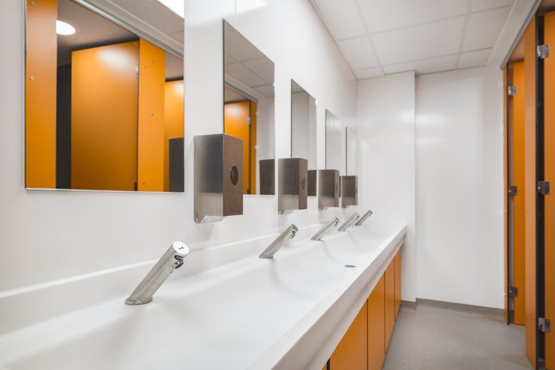 a school washroom with a solid surface trough hand washing area at ashcombe school.jpg