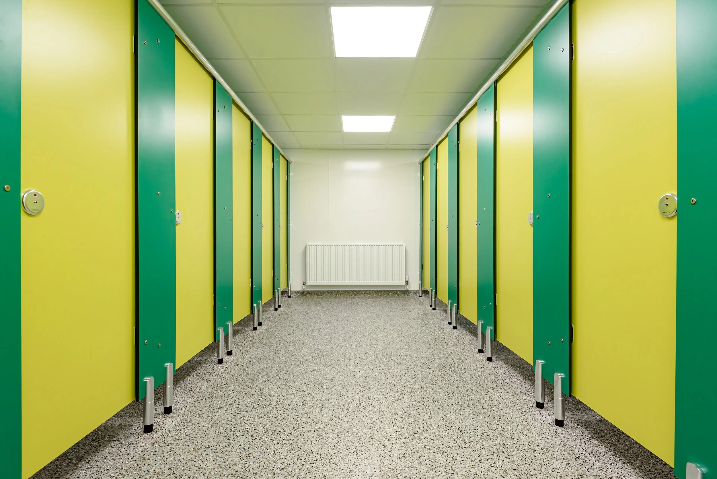 row of toilet cubicles in ladies toilet at London zoo.jpg
