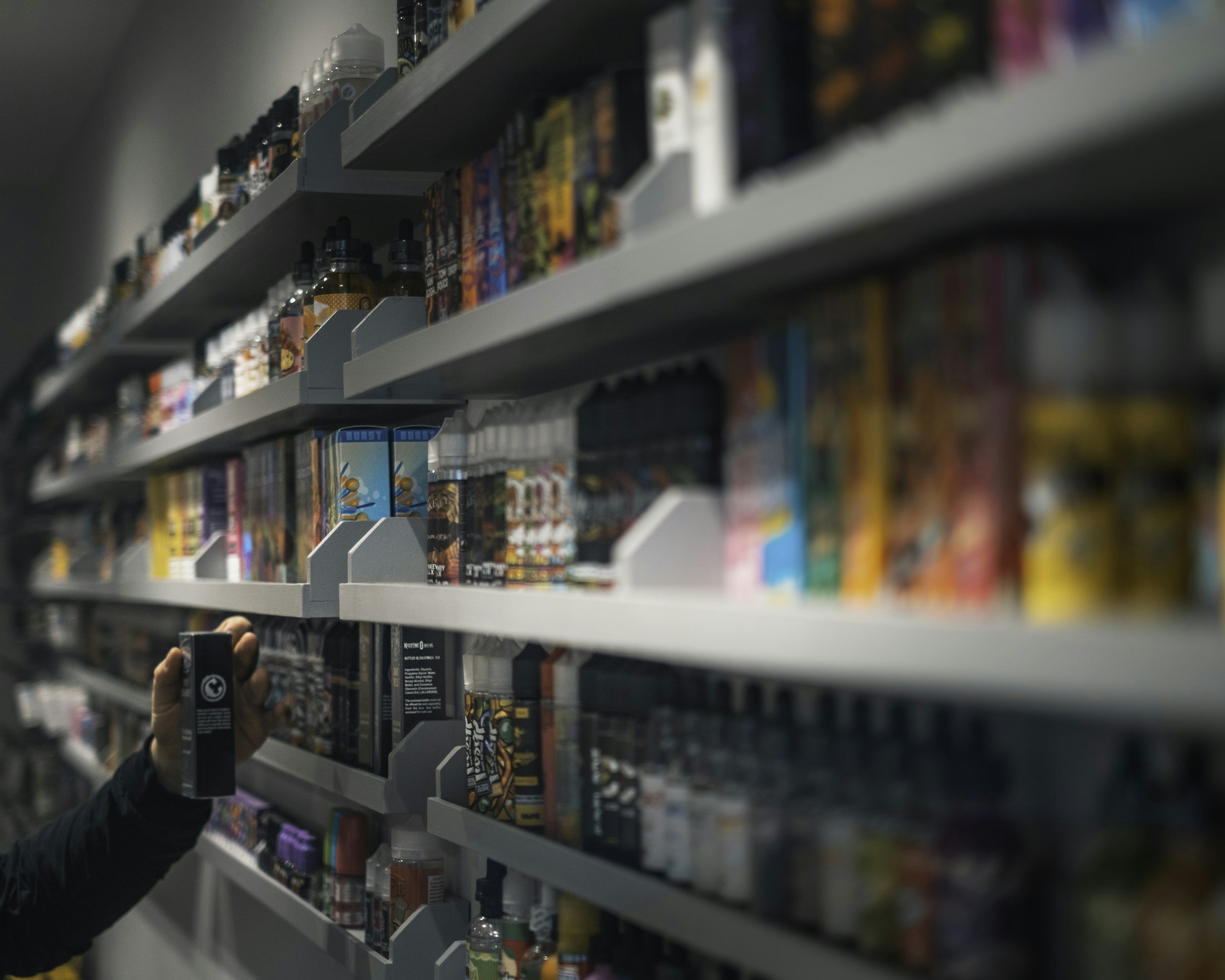 Vape products on a shop shelf.