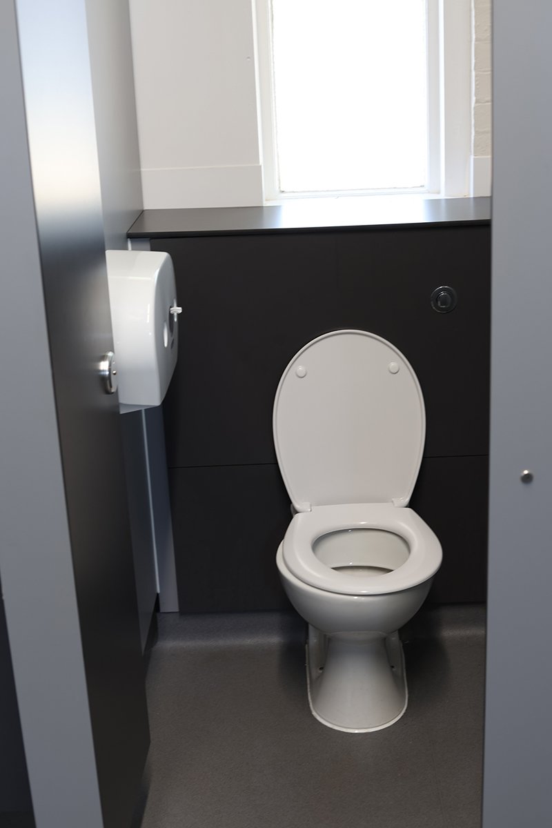 Toilet cubicle with duct panelling at Ascot Racecourse.jpg