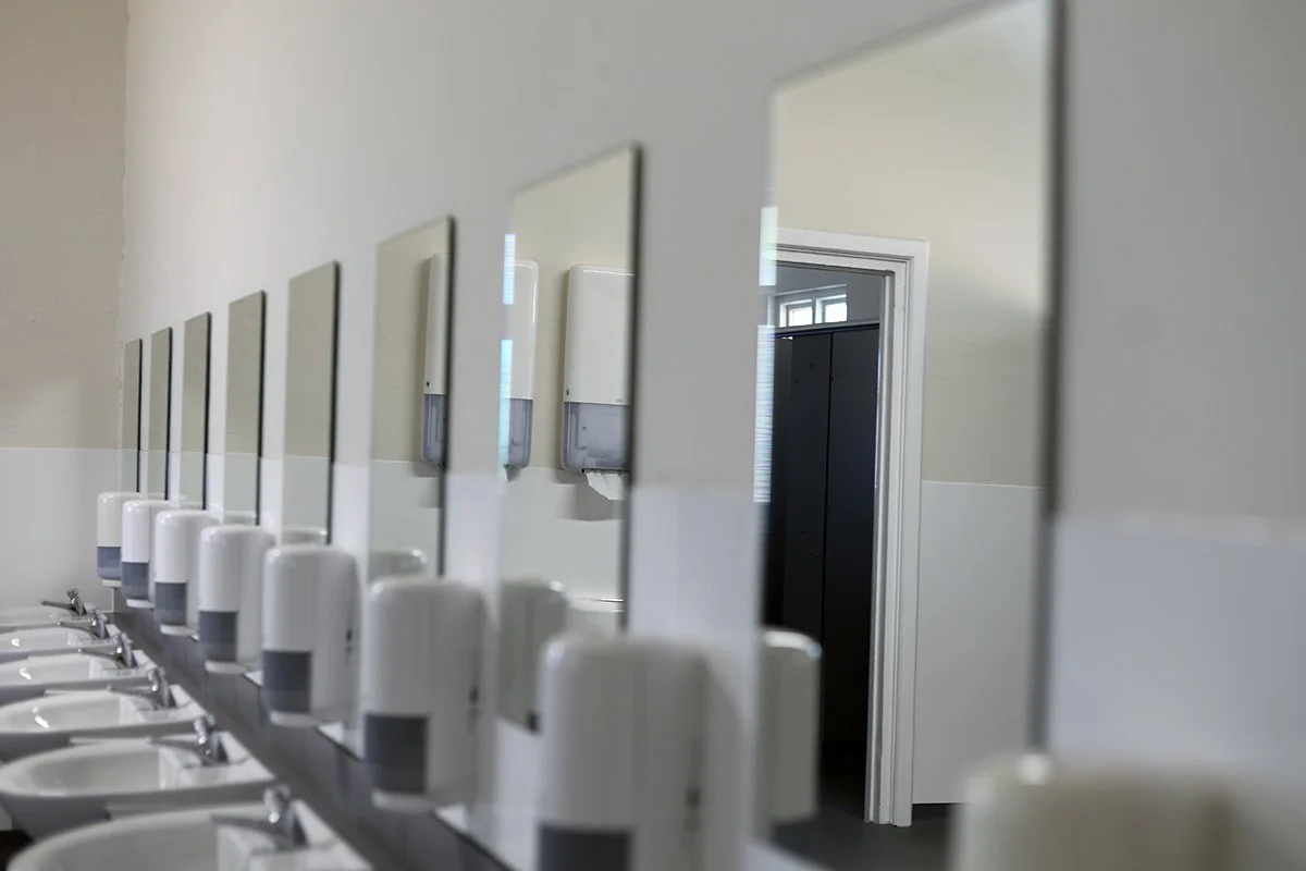 Row of wall mounted mirrors at Ascot Racecourse.jpg