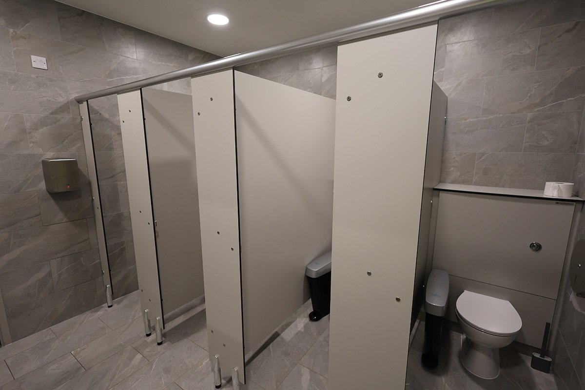 Row of solid grade laminate cubicles (right) at golf club.jpg