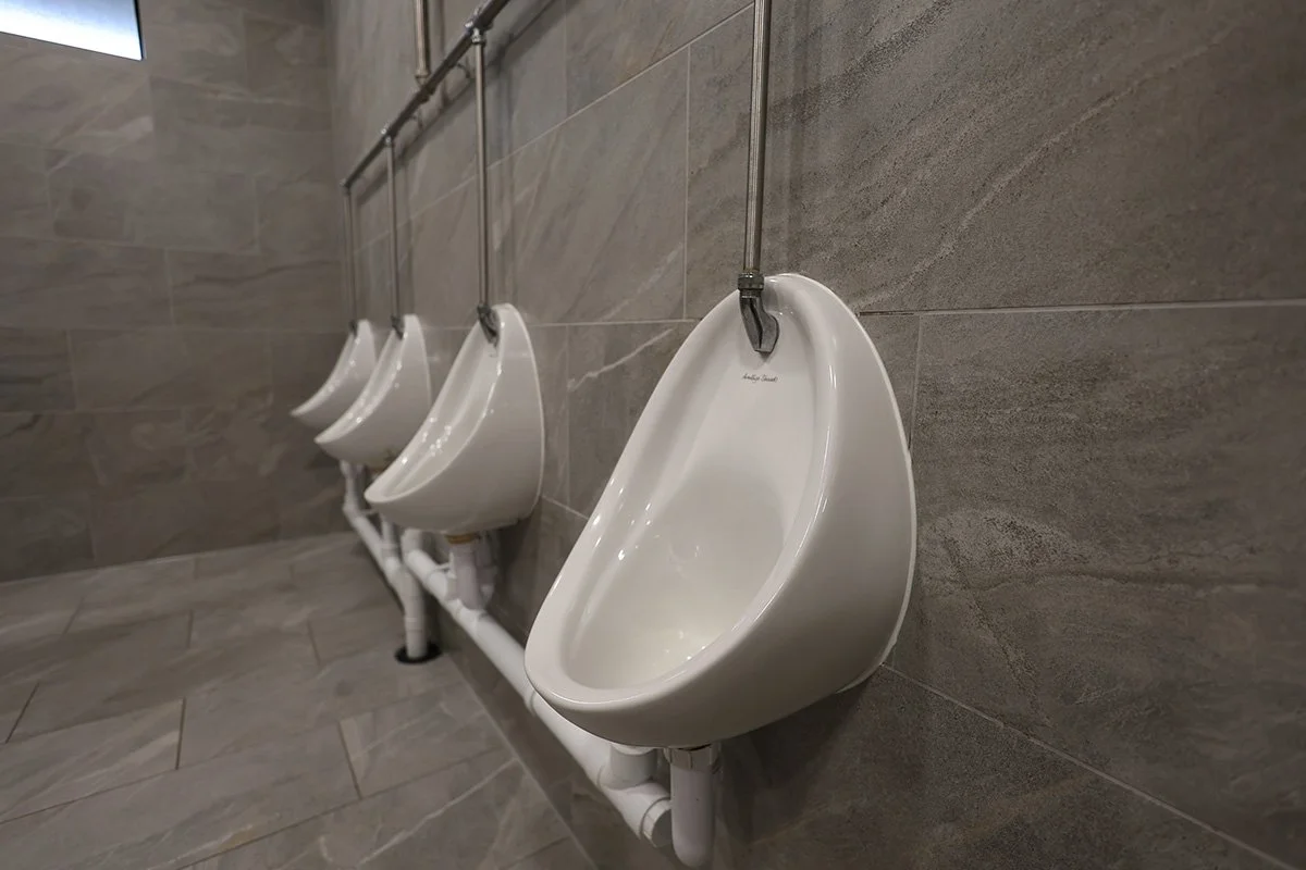 Close up of urinals at golf club.jpg