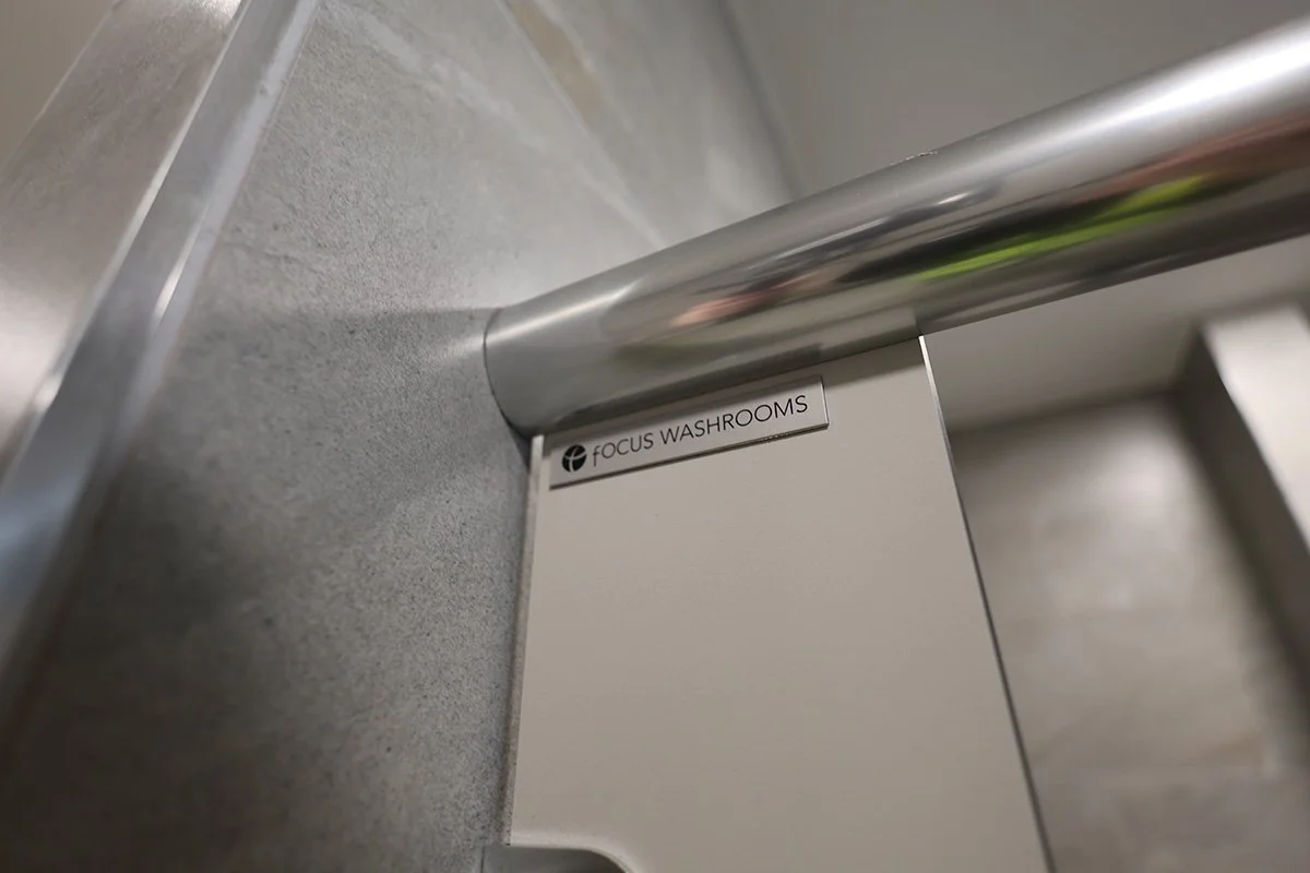 Focus washrooms badge on sgl cubicle at golf club.jpg