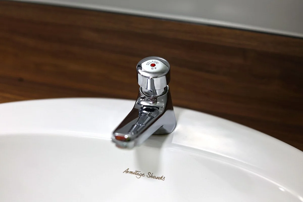 Close up of push tap at holiday park.jpg
