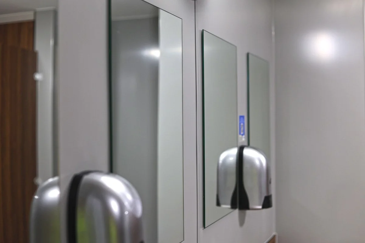 Mirrors and soap dispensers at holiday park.jpg