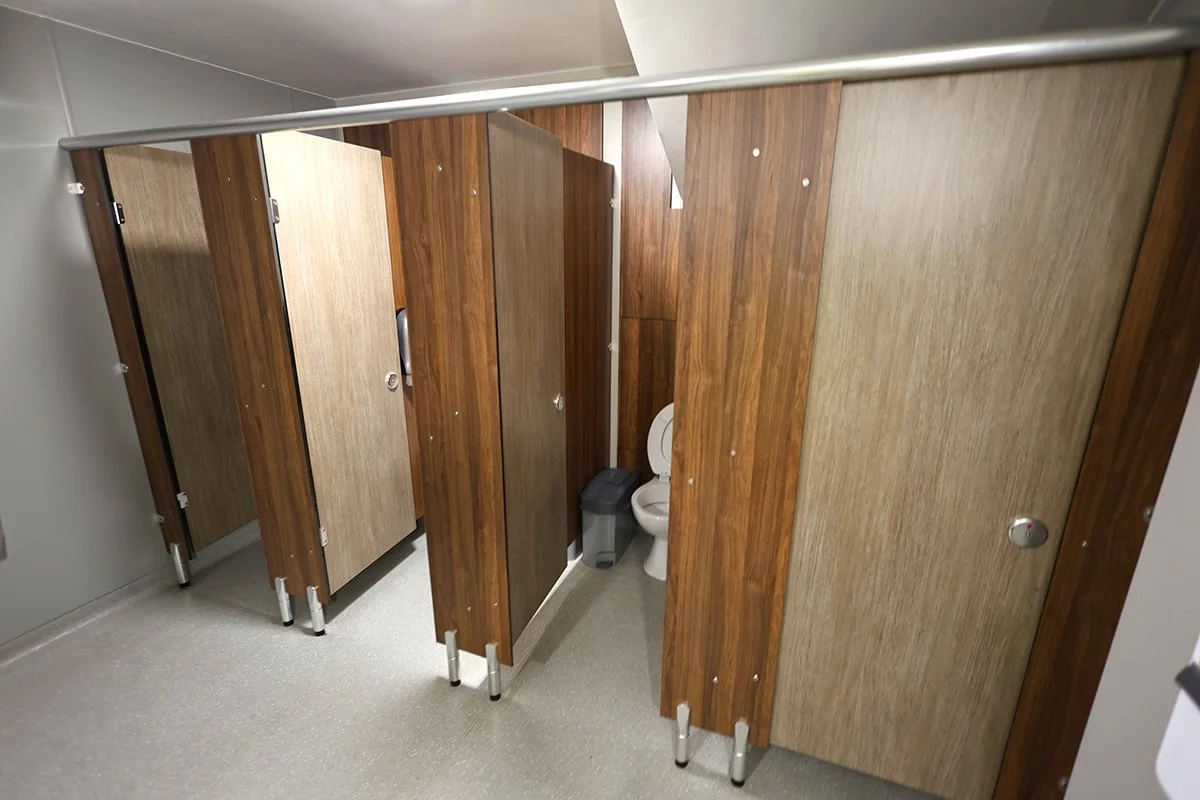 Open cubicles with wooden effect at holiday park.jpg