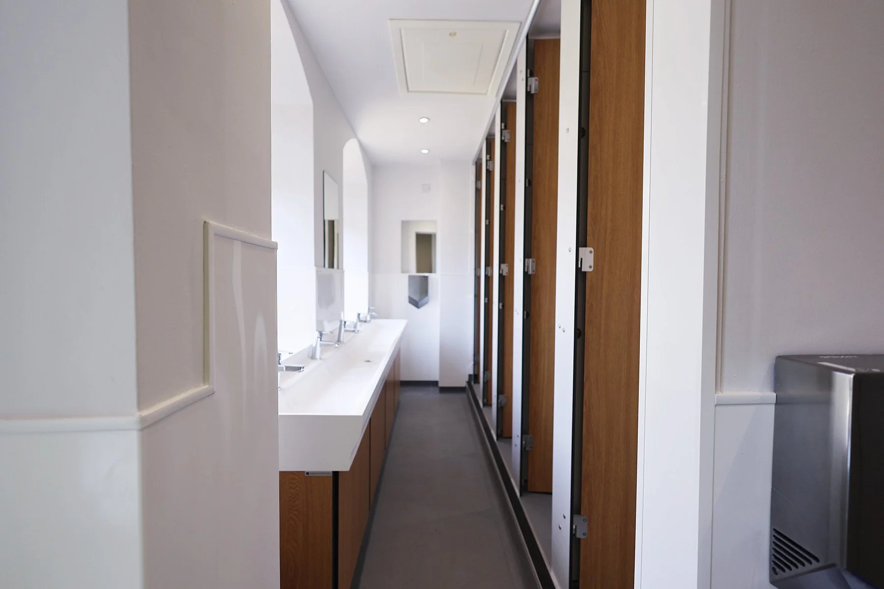 Full cubicle and basin set up at Lancing College.jpg