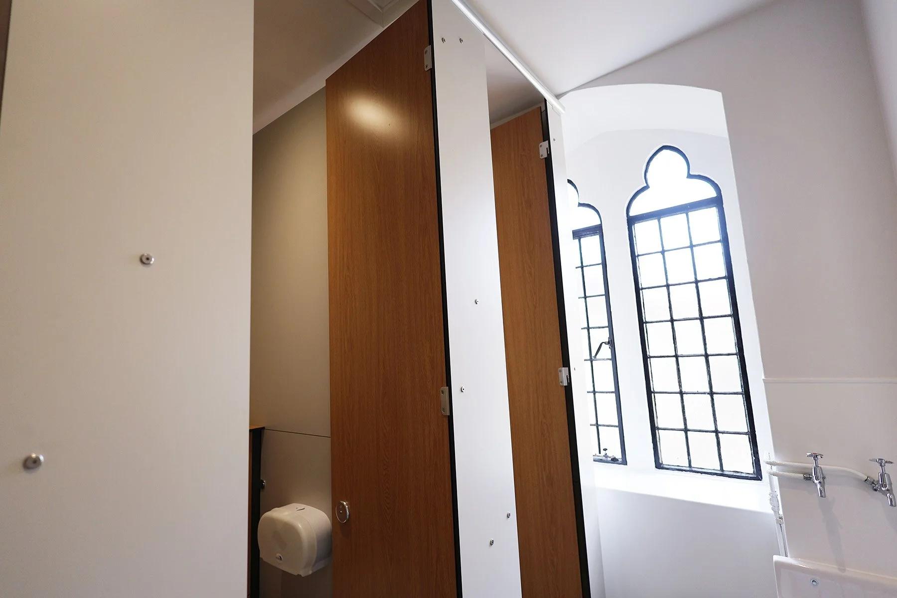 Full height cubicles with period window at Lancing College.jpg