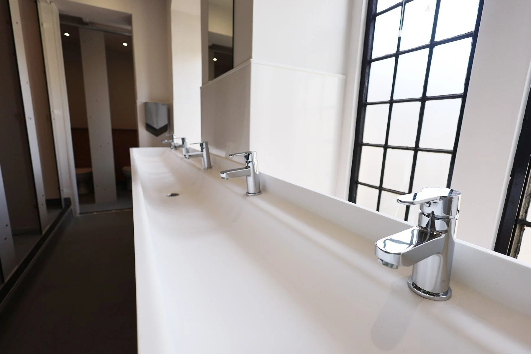 Trough basin with raised taps at Lancing College.jpg