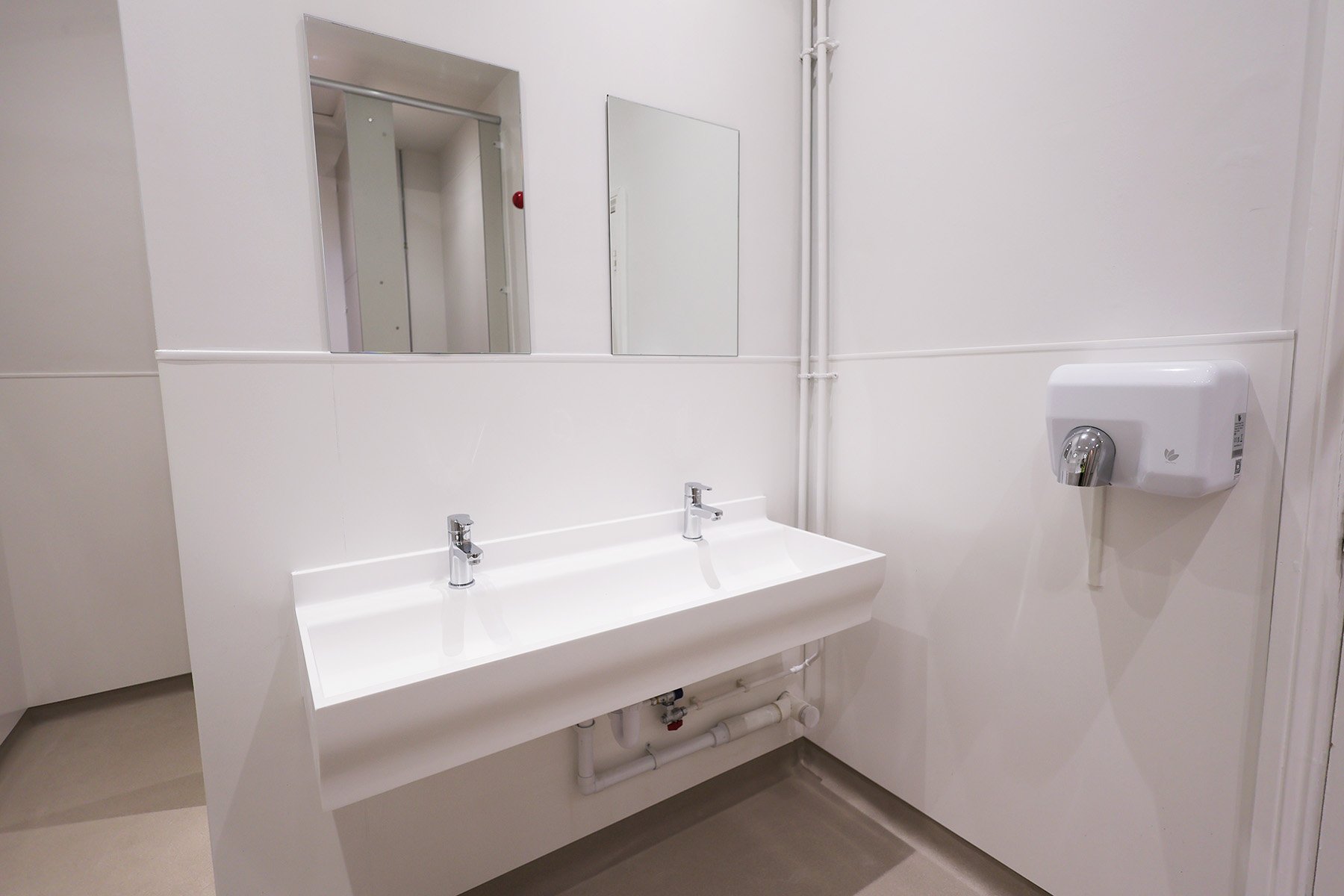 Floating trough basins with hand dryer at Lancing College.jpg