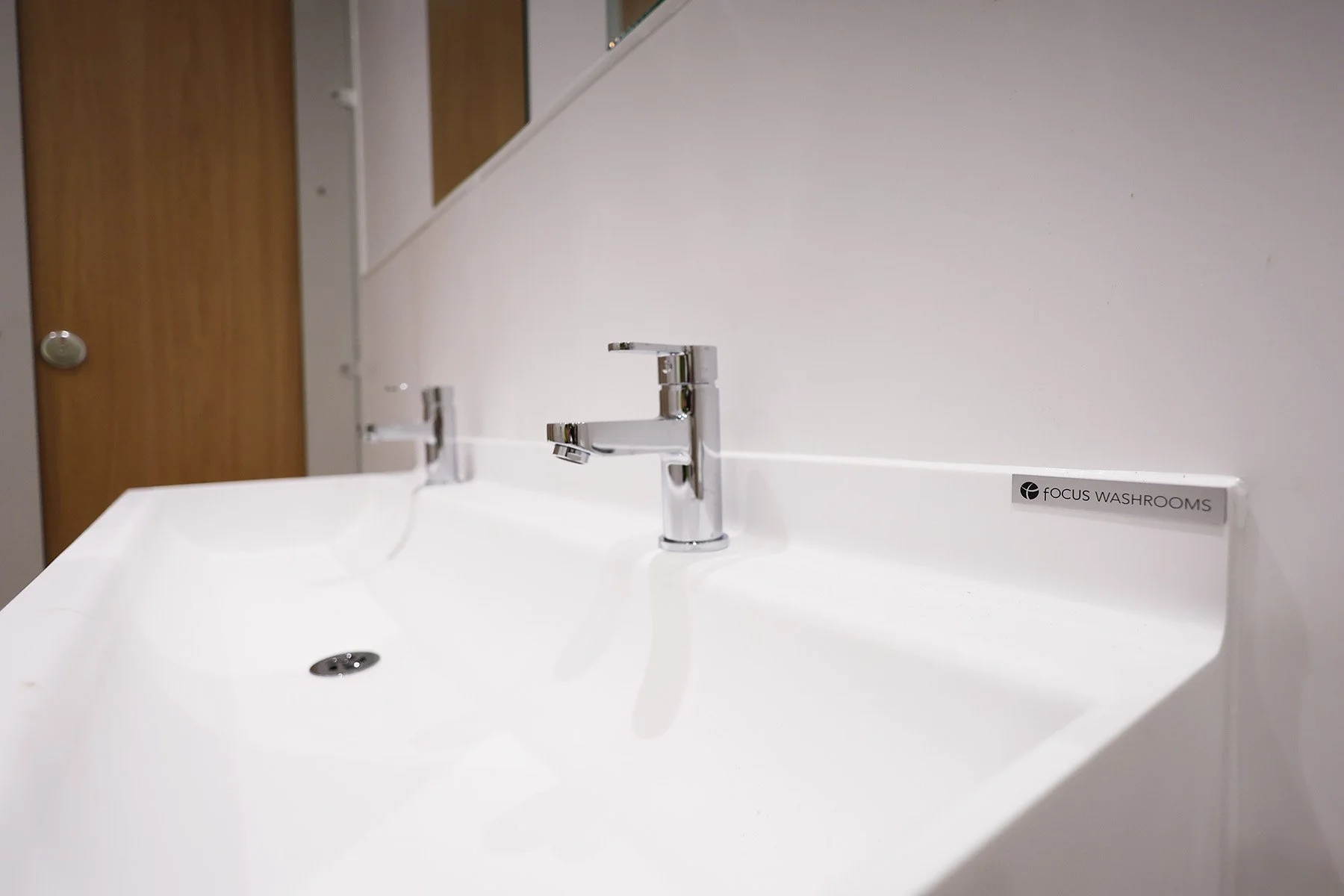 Raised taps on trough basin at Lancing College.jpg