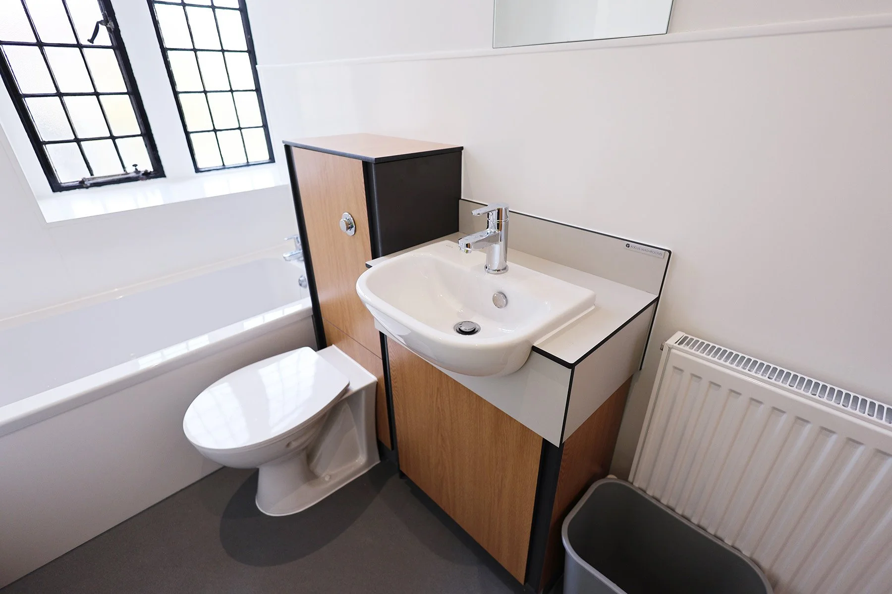 Back to wall toilet with integrated basin at Lancing College.jpg