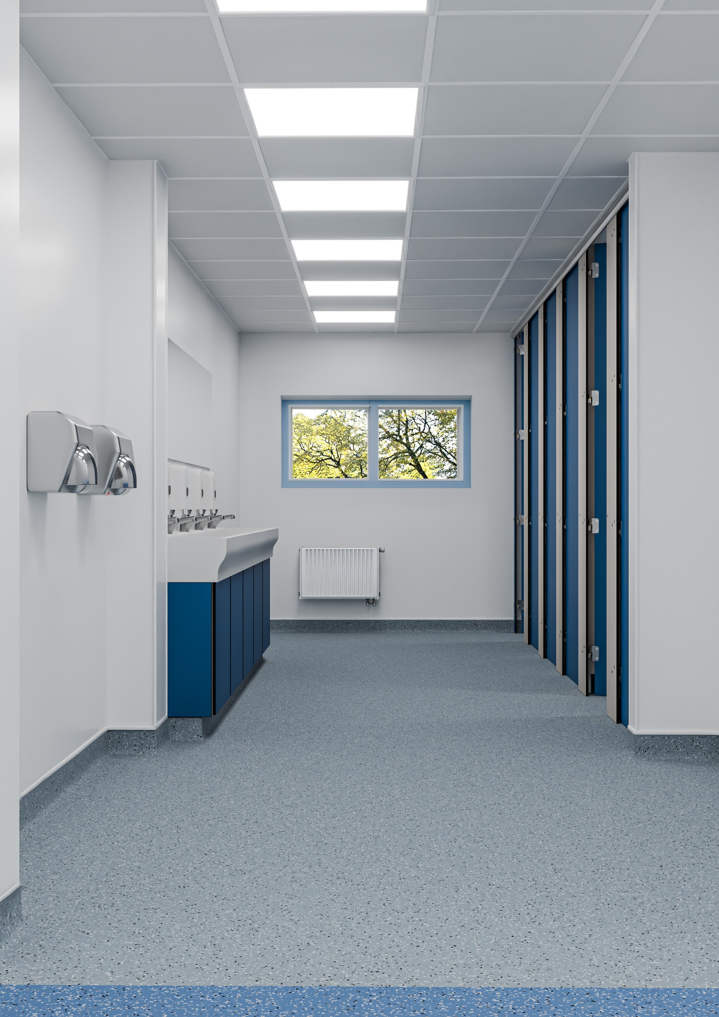 A clean, minimalist room with white walls, a row of blue cubicles, a white sink with three soap dispensers, a window showing trees outside, a radiator, and a ceiling with bright fluorescent lights.