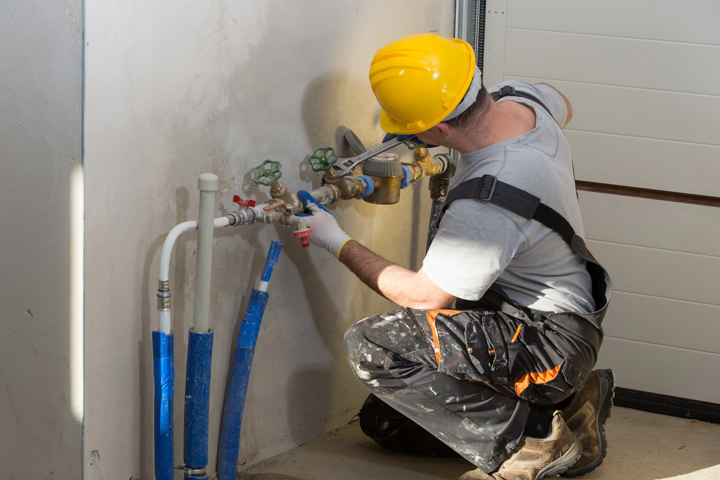 plumber working on focus washooms site