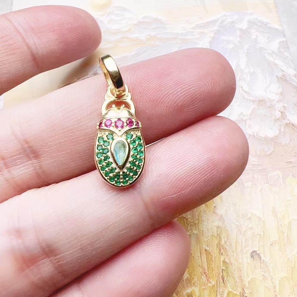stoned scarab beetle charm.jpeg
