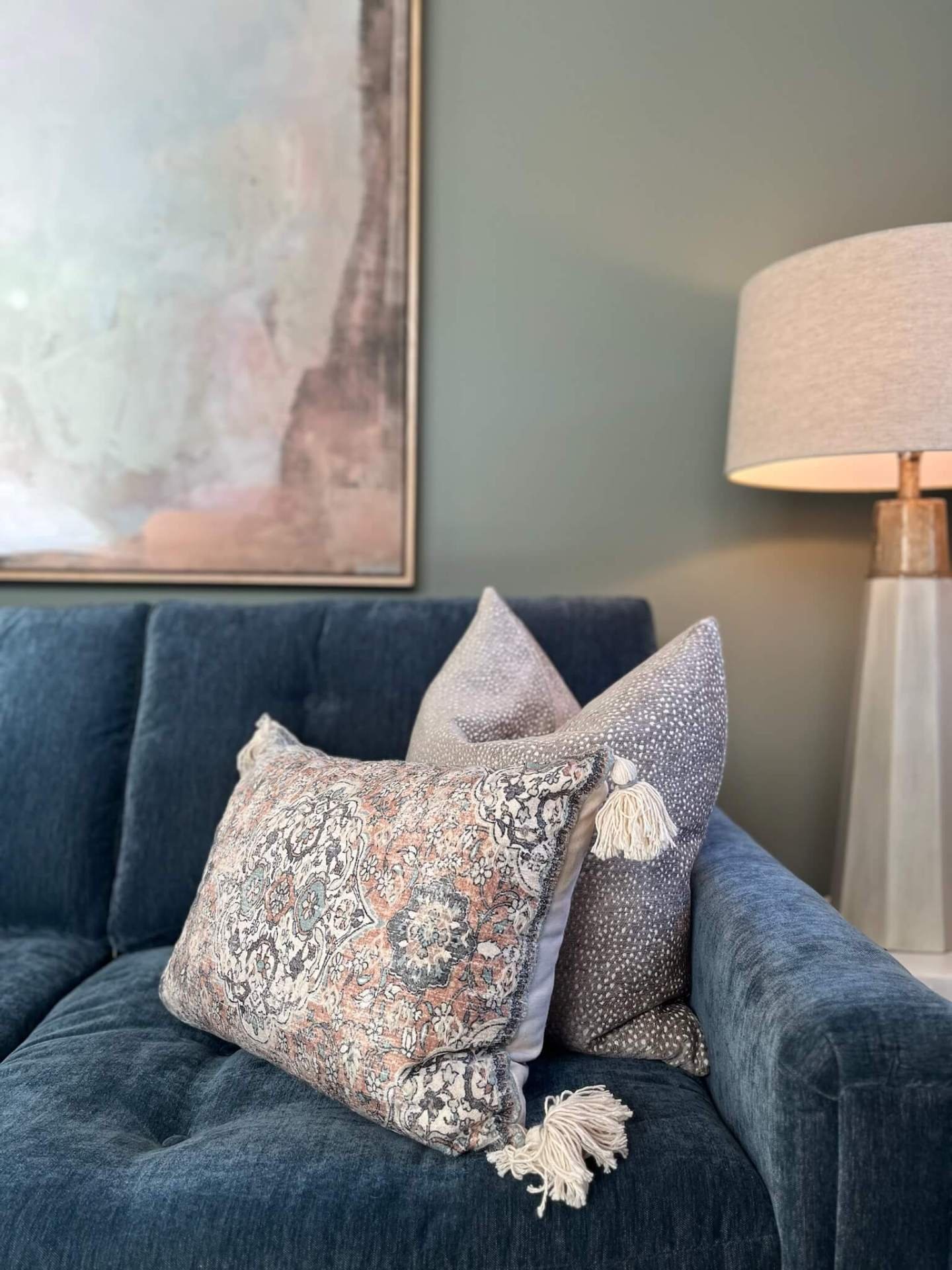 TIME TO GET COZY. This keeping room came together as a warm, inviting space designed to be both beautiful and lived in. Layered textures, a grounding rug, thoughtful art, and styled details bring the room to life, with this fabulous Schumacher wallpa