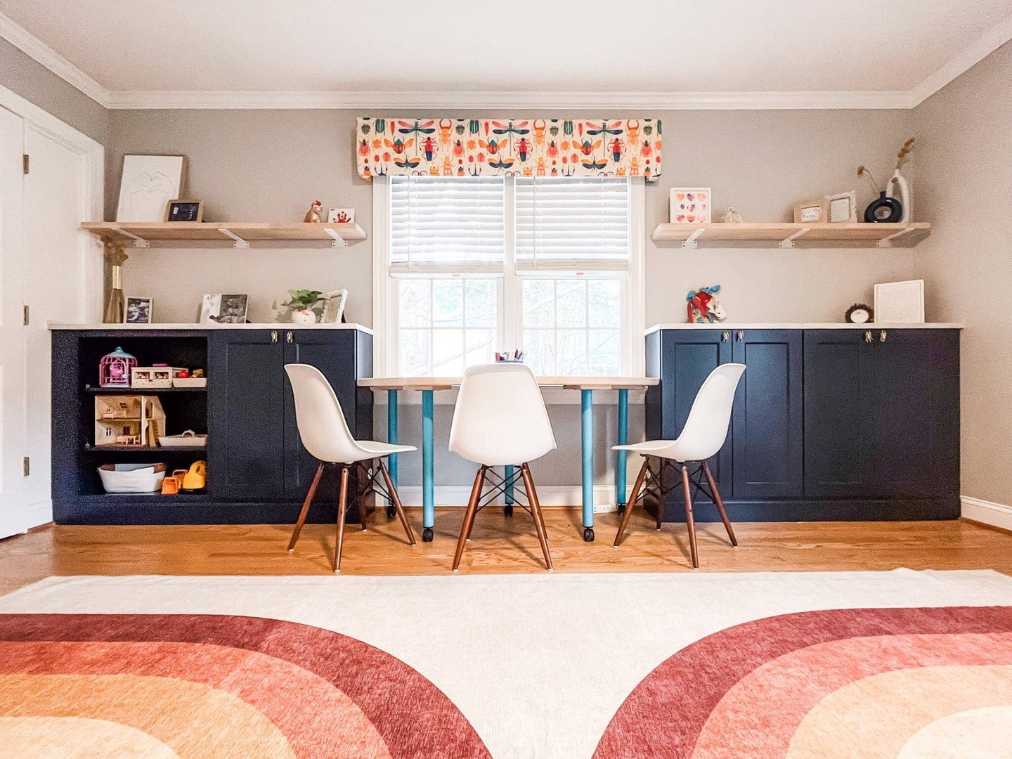 A SPACE FOR CREATIVITY TO GROW. Designing this playroom, I put both the designer and "mom" hat on, knowing that while it needed to look great, function and smart storage was key. 

Designed with bright colors, organized toy storage and a cu