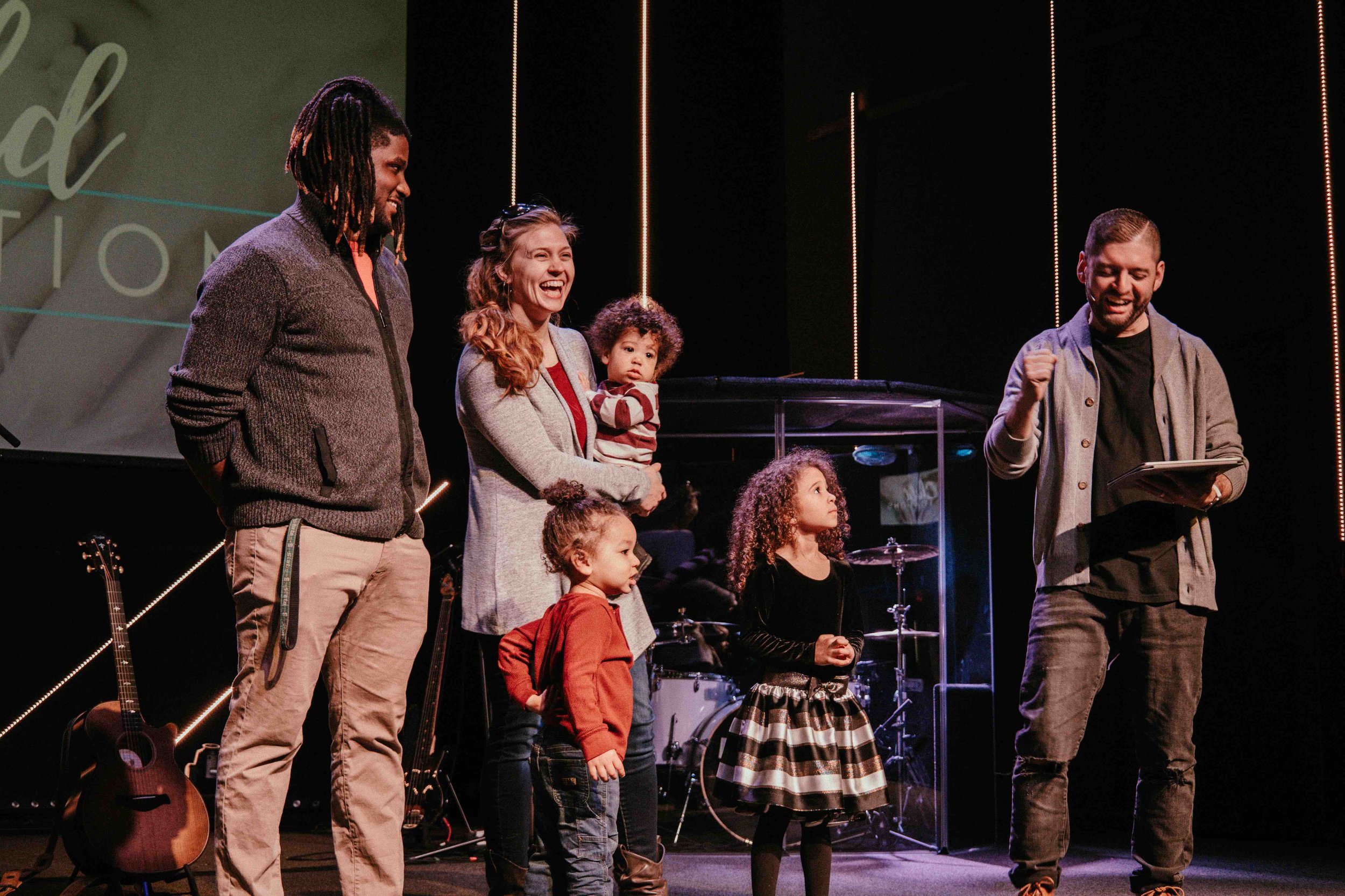 Family dedicating child at Radiant Church Bay City