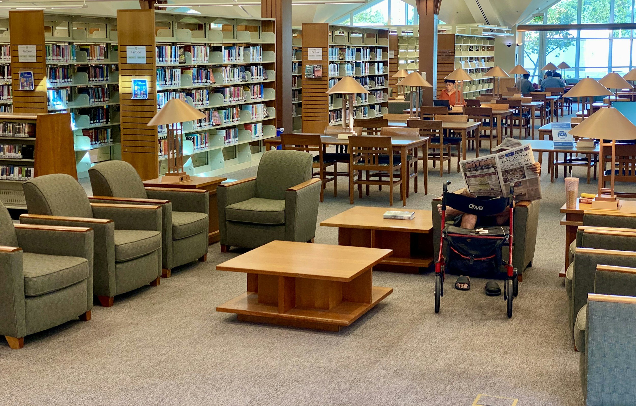A public library reading area, one of the few free third places left in most towns