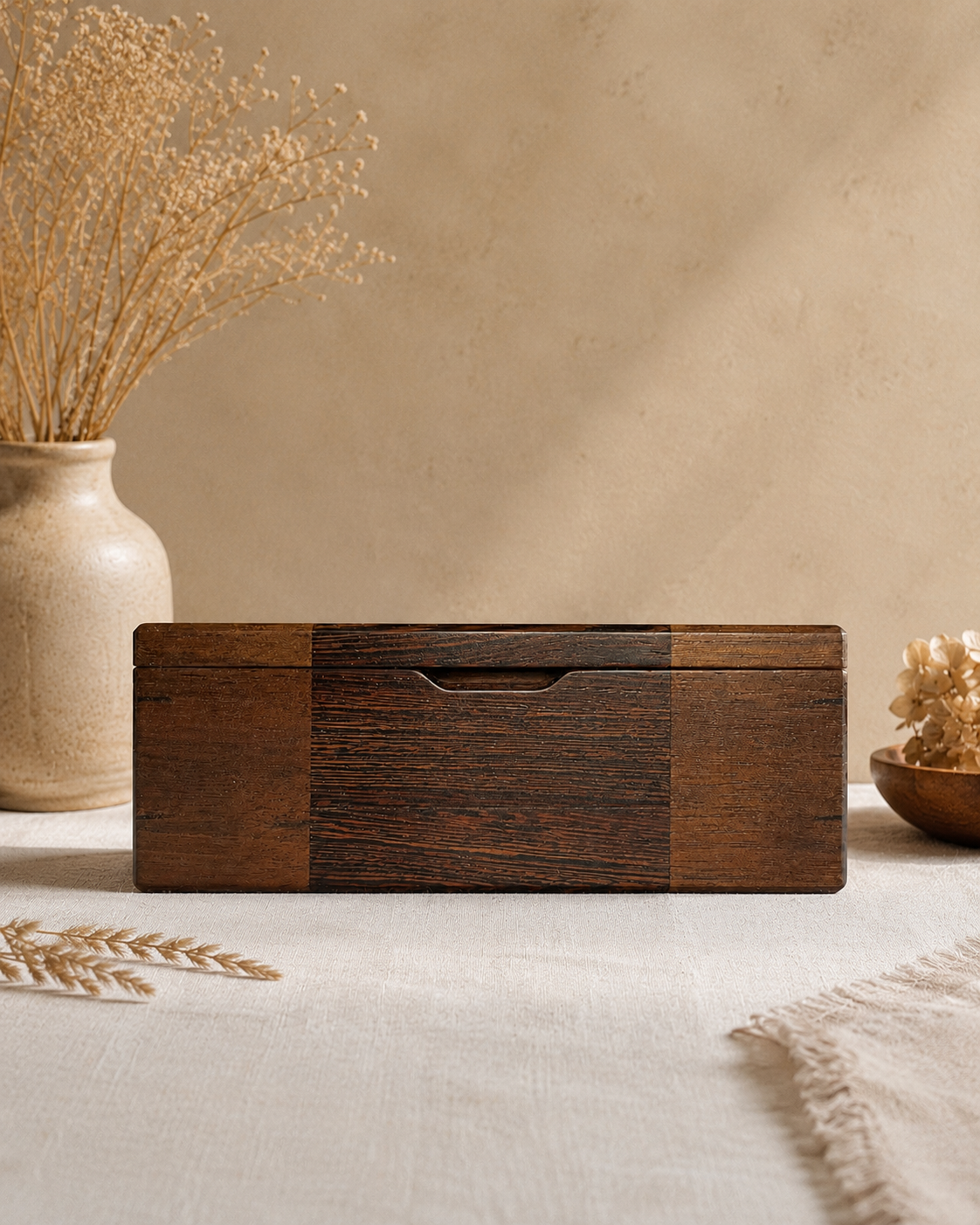 Crafted from a refined pairing of Wenge and Peruvian Walnut, this box highlights the beauty of natural contrasts and precise craftsmanship. Strengthened with Wenge splines at each mitered corner, it’s built to last while retaining a graceful silhouet