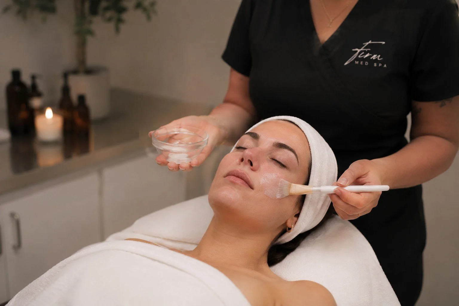 Client relaxing while receiving a customized facial at Firm Medspa in Tulsa, Oklahoma