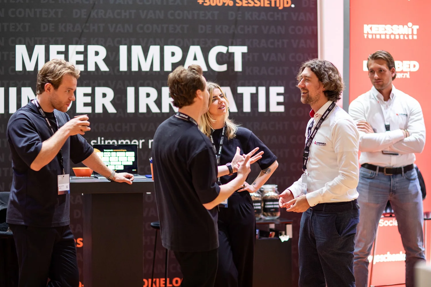 Visitors talking with start-ups at an Emerce event