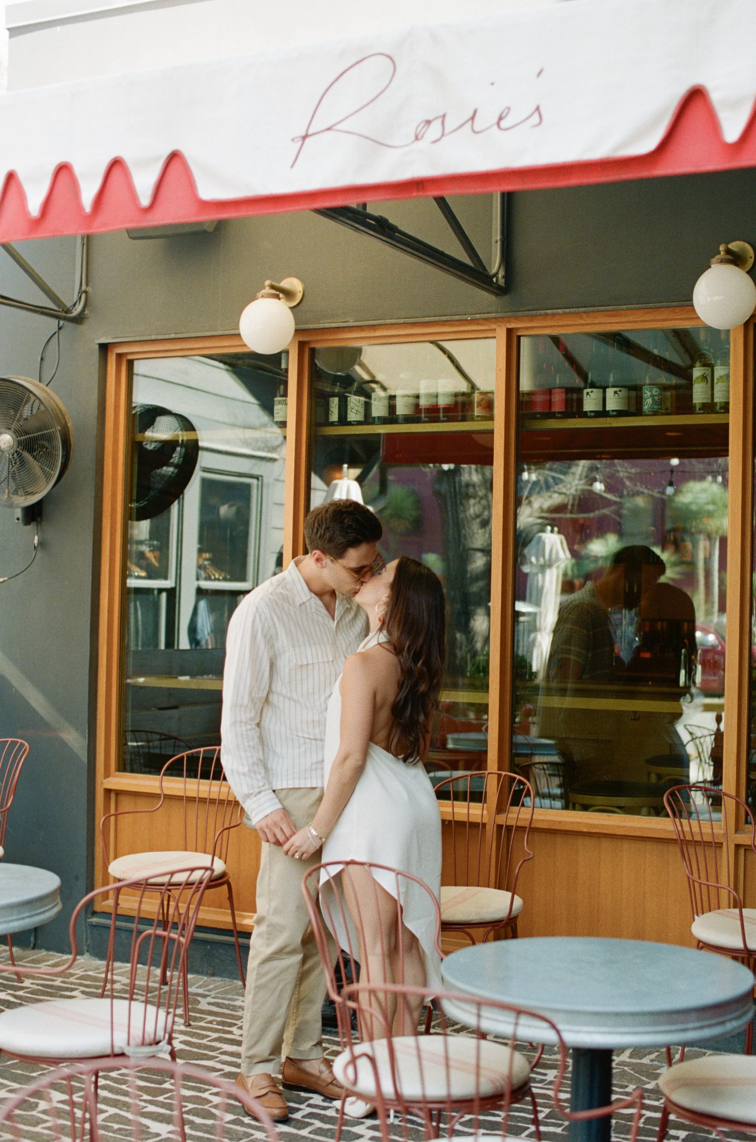 Candid engagement portraits inside Rosie's Wine Bar, Austin TX — analog film photography by Lauren Nicole Photo