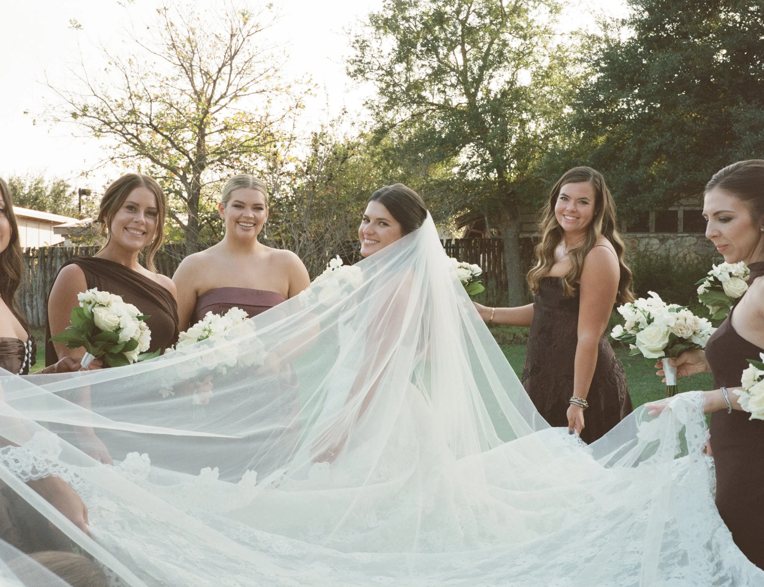 Wedding ceremony under oaks at Camp Lucy Sacred Oaks, Dripping Springs TX — Kristin Cattered Events, film photography by Lauren Nicole