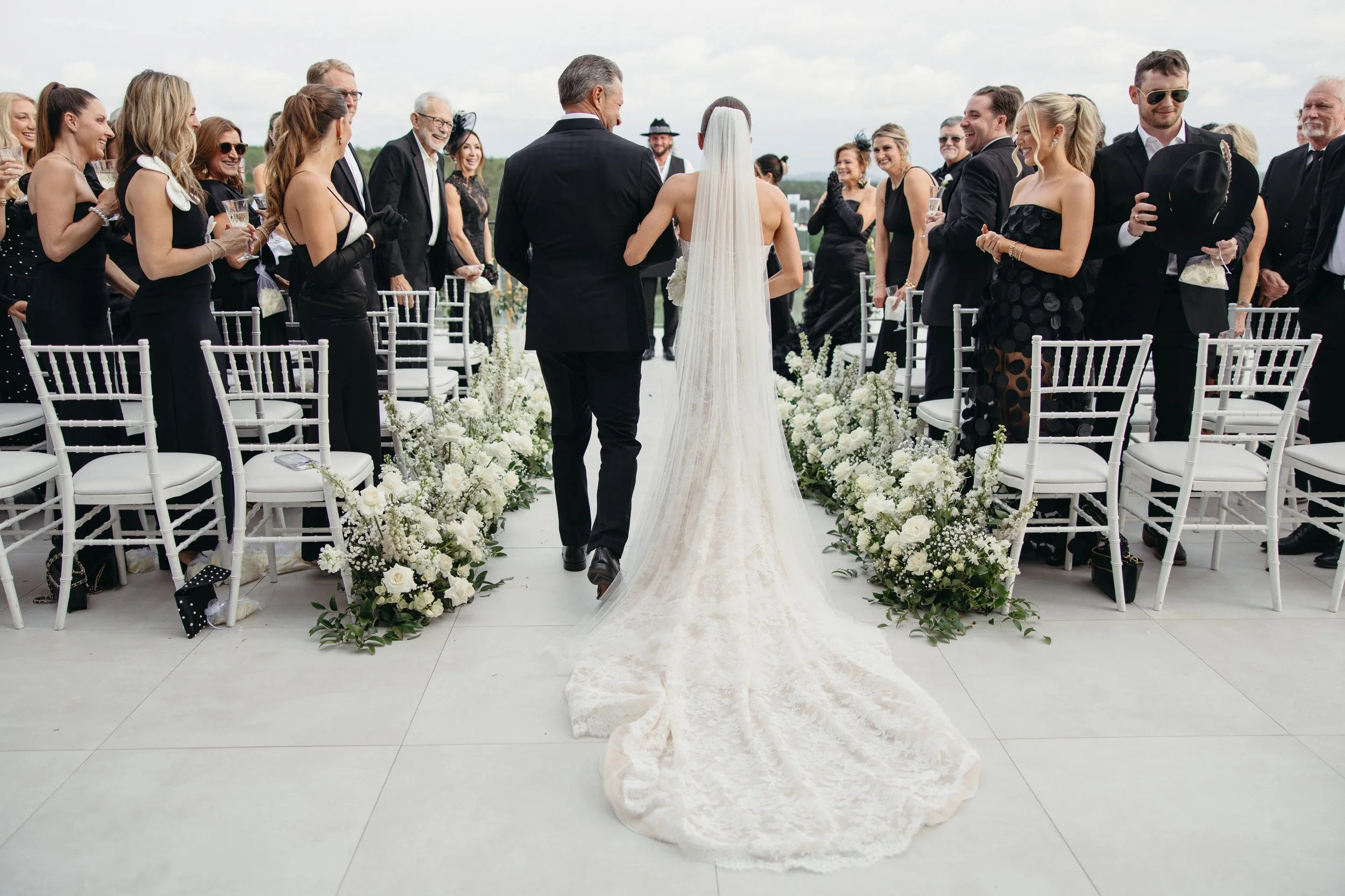 Wedding ceremony at The Videre Estate Wimberley Texas — Kentucky Derby aesthetic, black and white attire, film photography by Lauren Nicole Photo