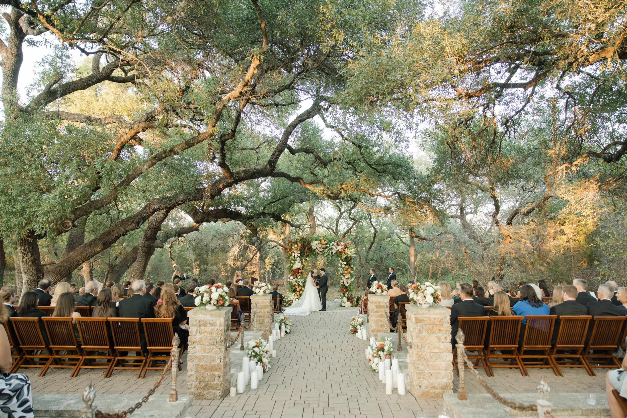 Wedding ceremony under oaks at Camp Lucy Sacred Oaks, Dripping Springs TX — Kristin Cattered Events, film photography by Lauren Nicole