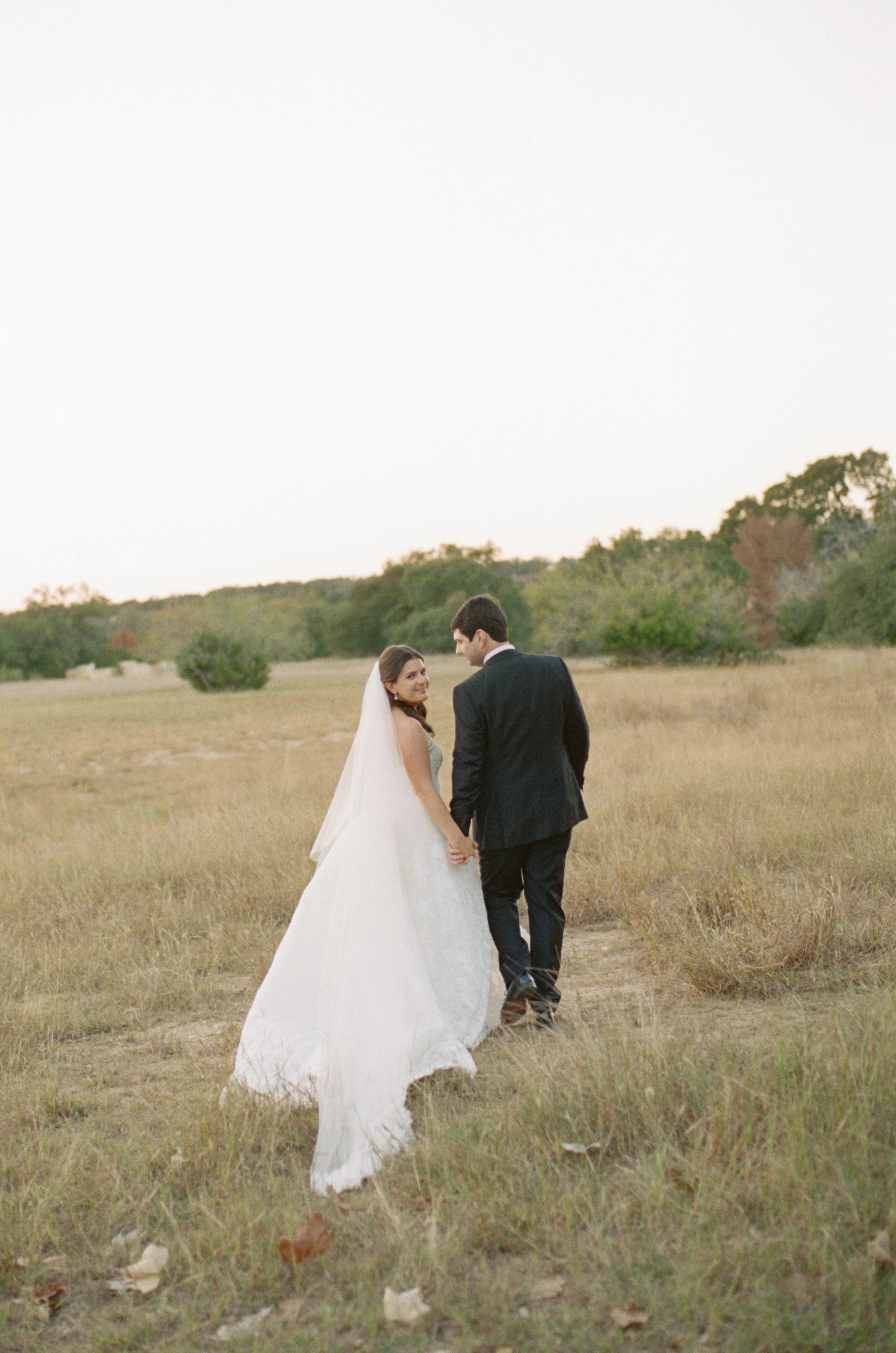 Old money floral wedding reception at Camp Lucy Sacred Oaks — candid documentary dance floor photography by Lauren Nicole Photo