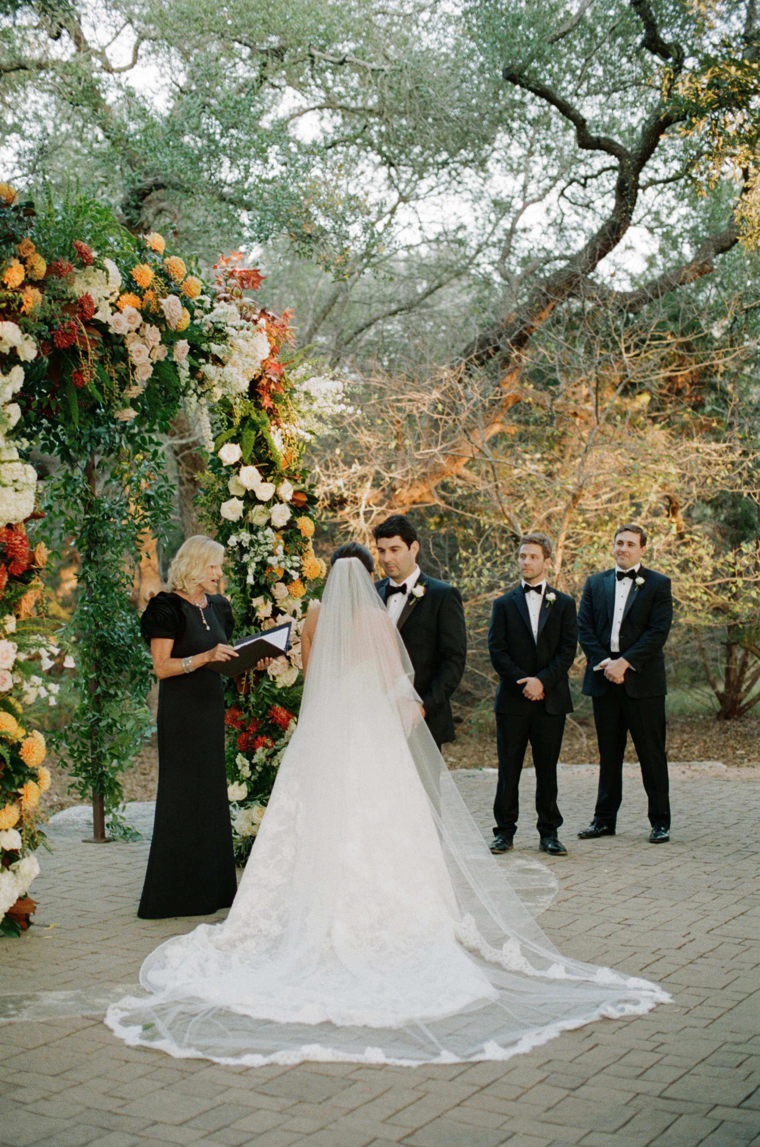 Wedding ceremony under oaks at Camp Lucy Sacred Oaks, Dripping Springs TX — Kristin Cattered Events, film photography by Lauren Nicole