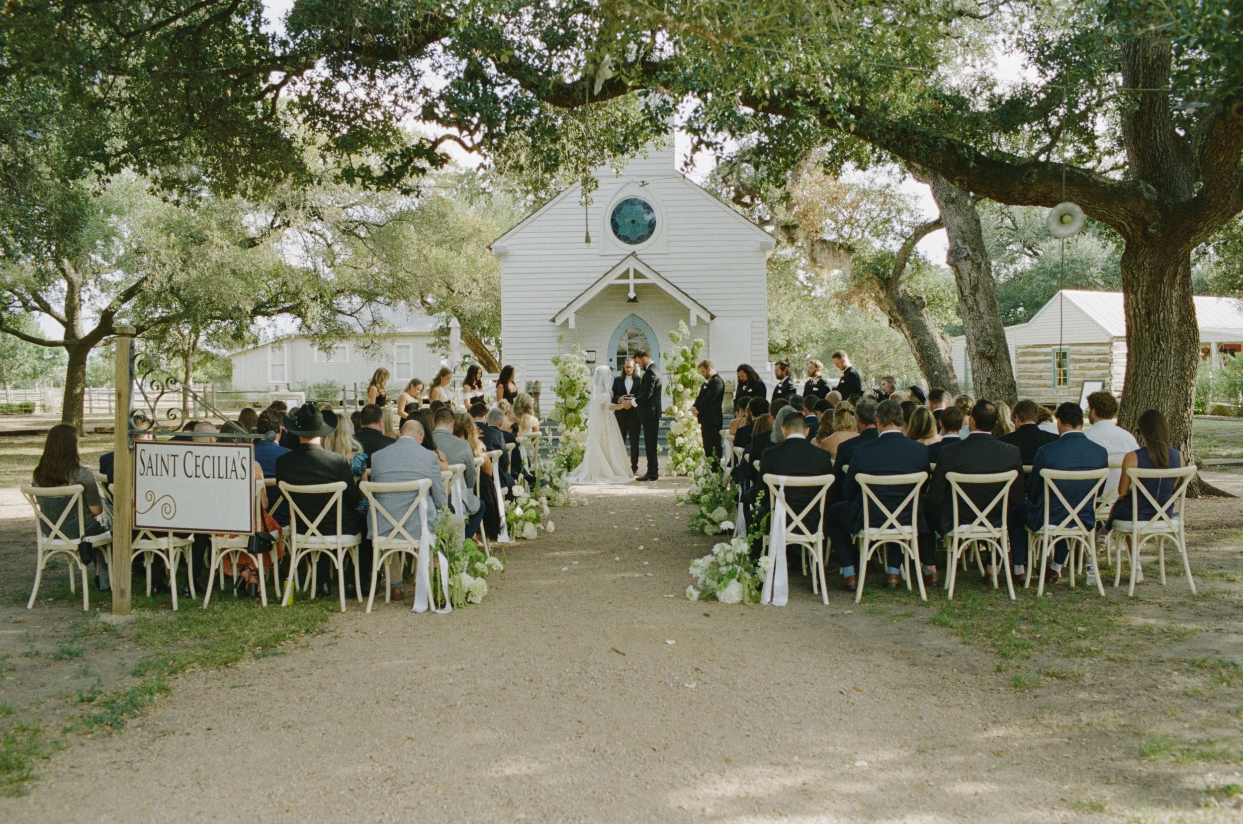 Wedding ceremony at Hotel Lulu Round Top Texas — southern chic western glam, candid film photography by Lauren Nicole Photo