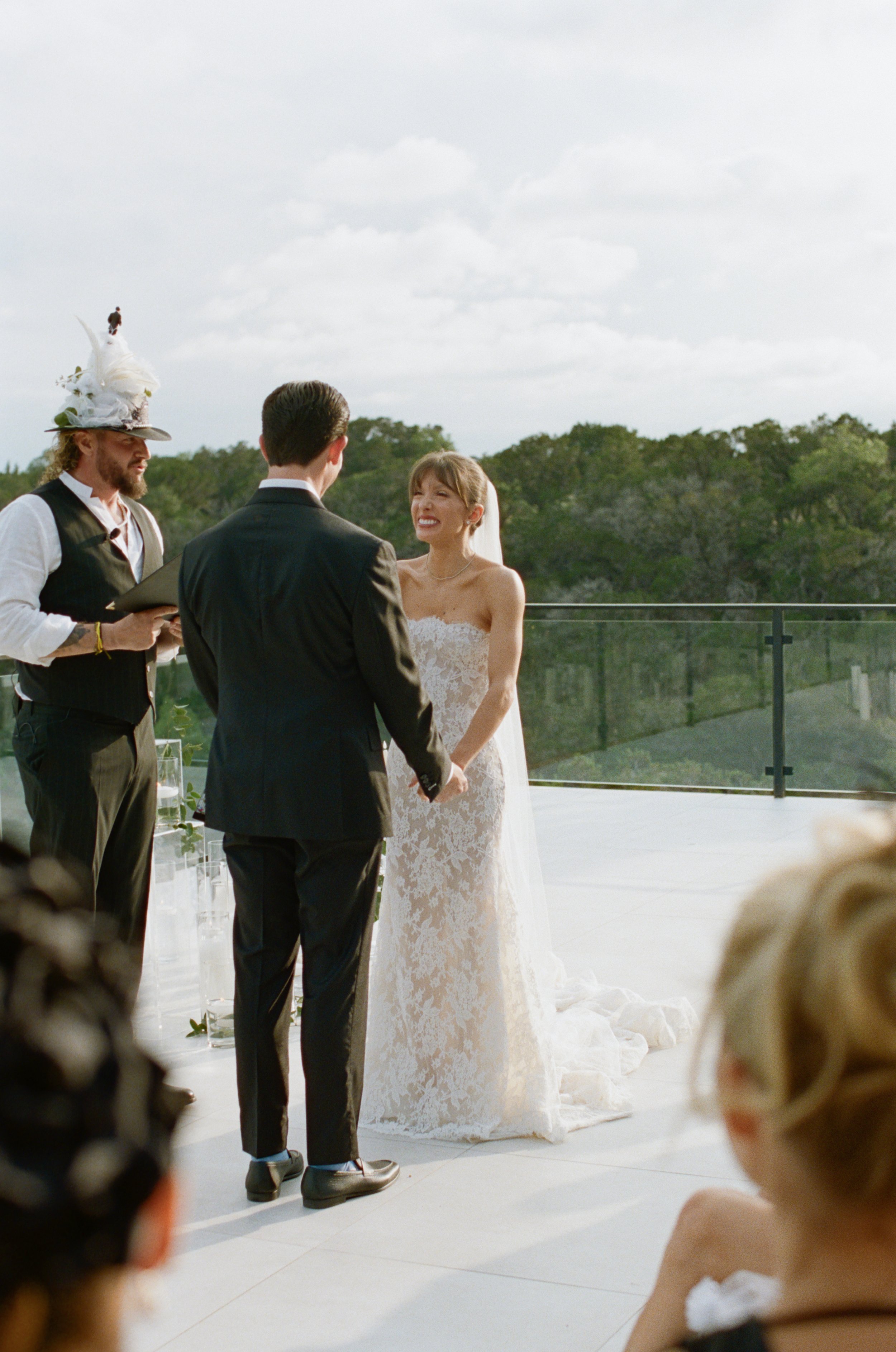 Wedding ceremony at The Videre Estate Wimberley Texas — Kentucky Derby aesthetic, black and white attire, film photography by Lauren Nicole Photo