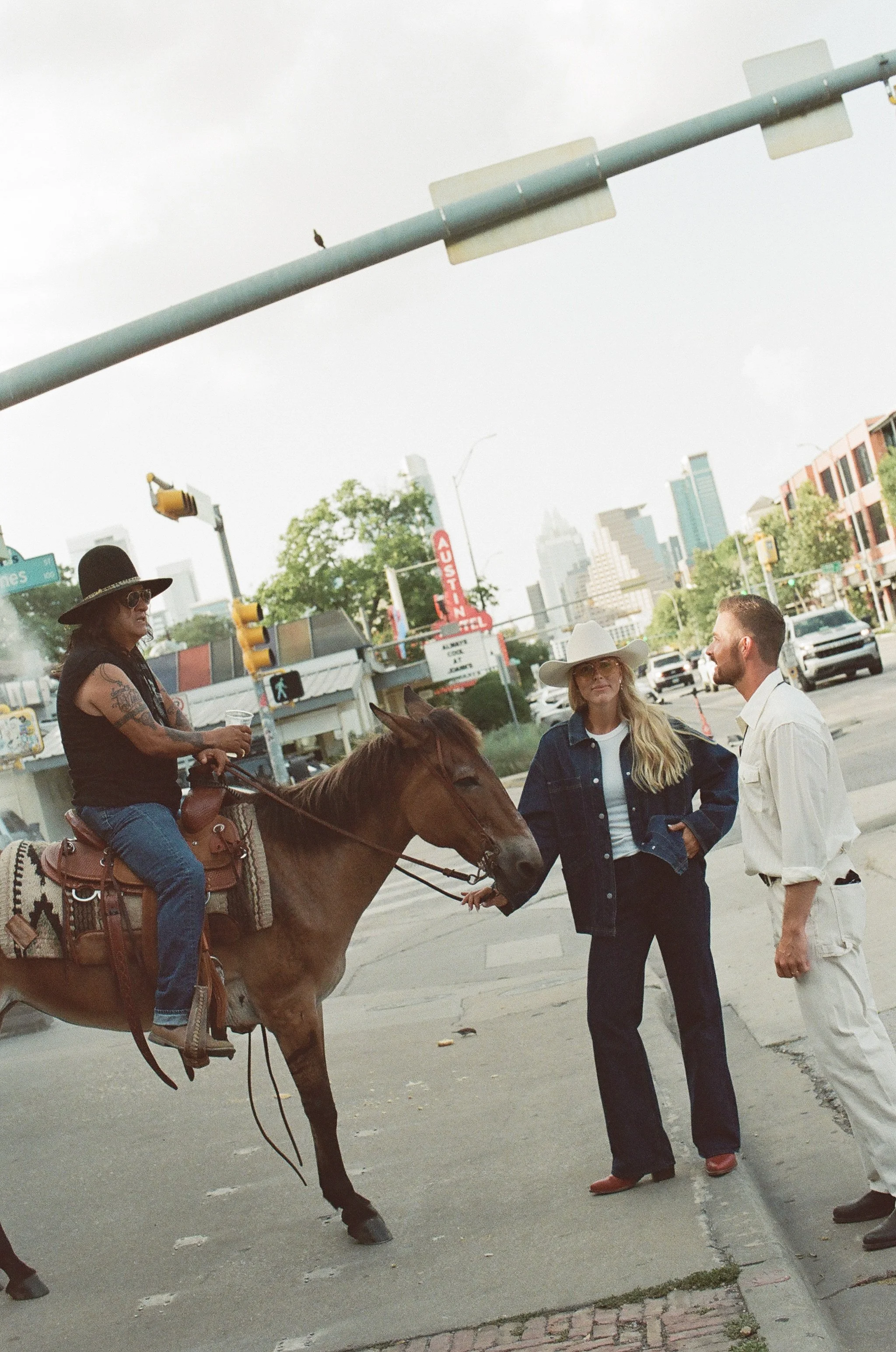Western high fashion engagement session on South Congress, Austin Texas — Allen's Boots, Tecovas, editorial film photography by Lauren Nicole Photo