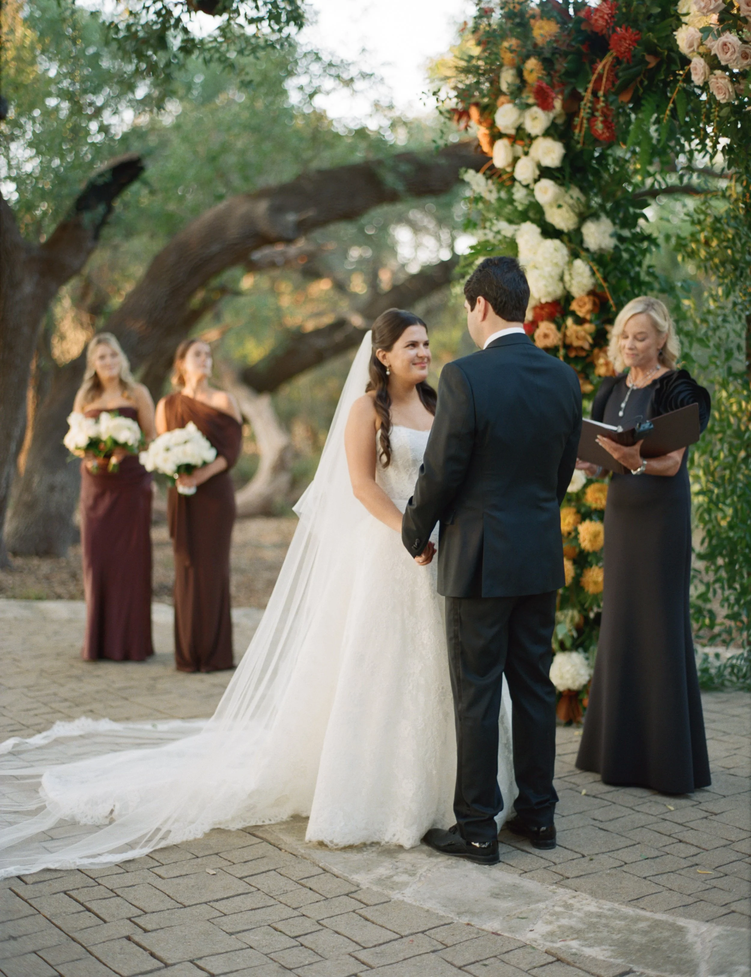 Wedding ceremony under oaks at Camp Lucy Sacred Oaks, Dripping Springs TX — Kristin Cattered Events, film photography by Lauren Nicole