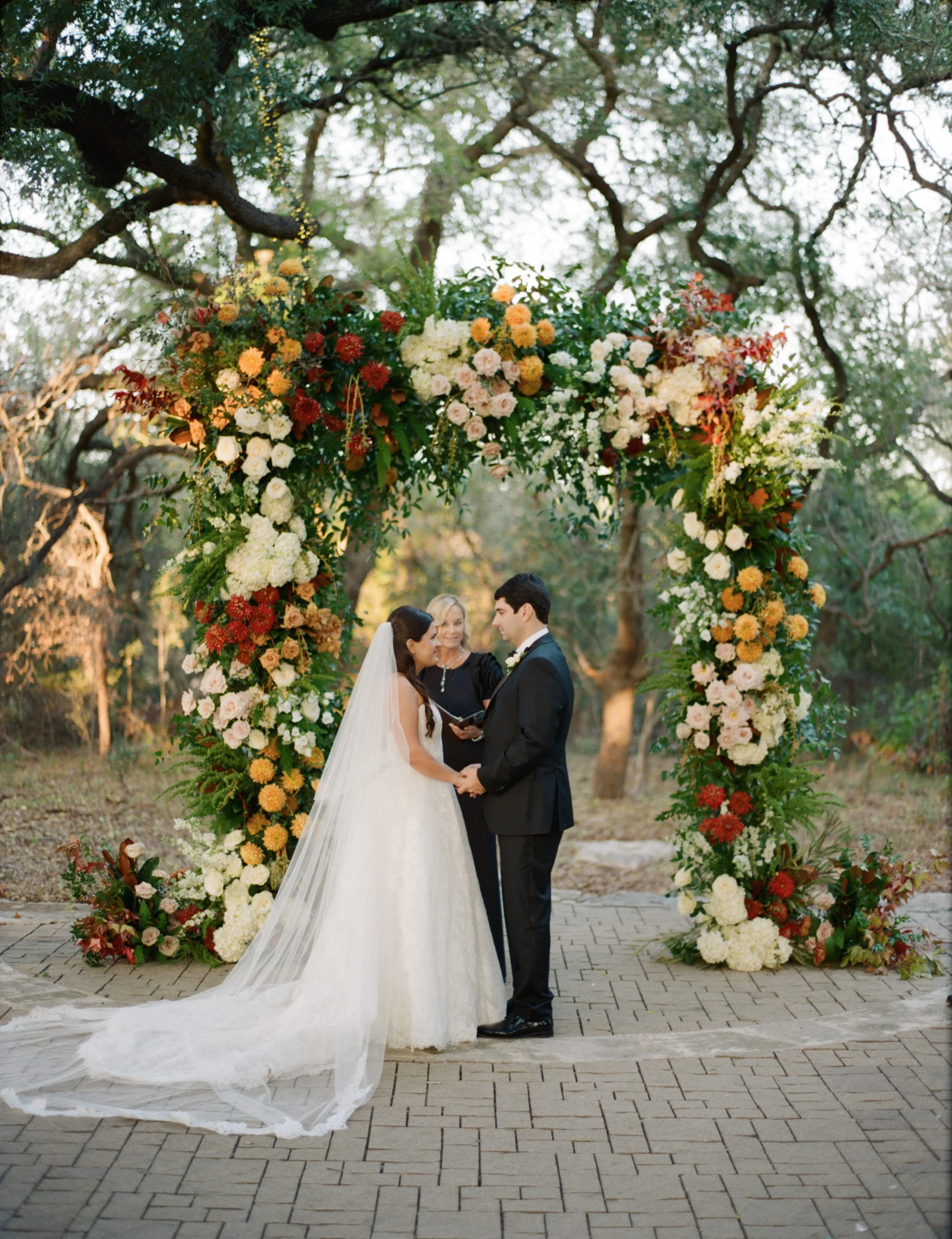 Wedding ceremony under oaks at Camp Lucy Sacred Oaks, Dripping Springs TX — Kristin Cattered Events, film photography by Lauren Nicole