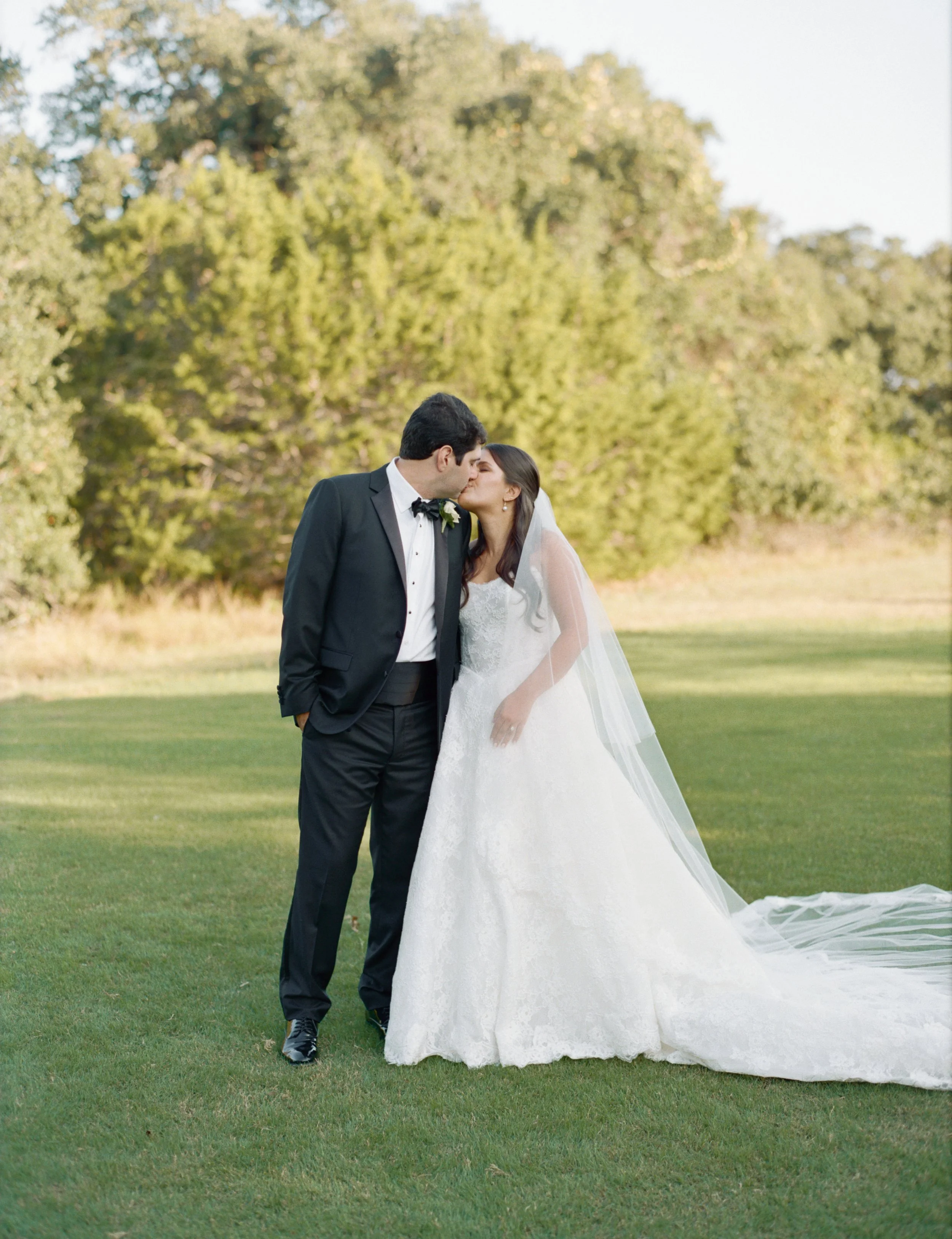 Wedding ceremony under oaks at Camp Lucy Sacred Oaks, Dripping Springs TX — Kristin Cattered Events, film photography by Lauren Nicole