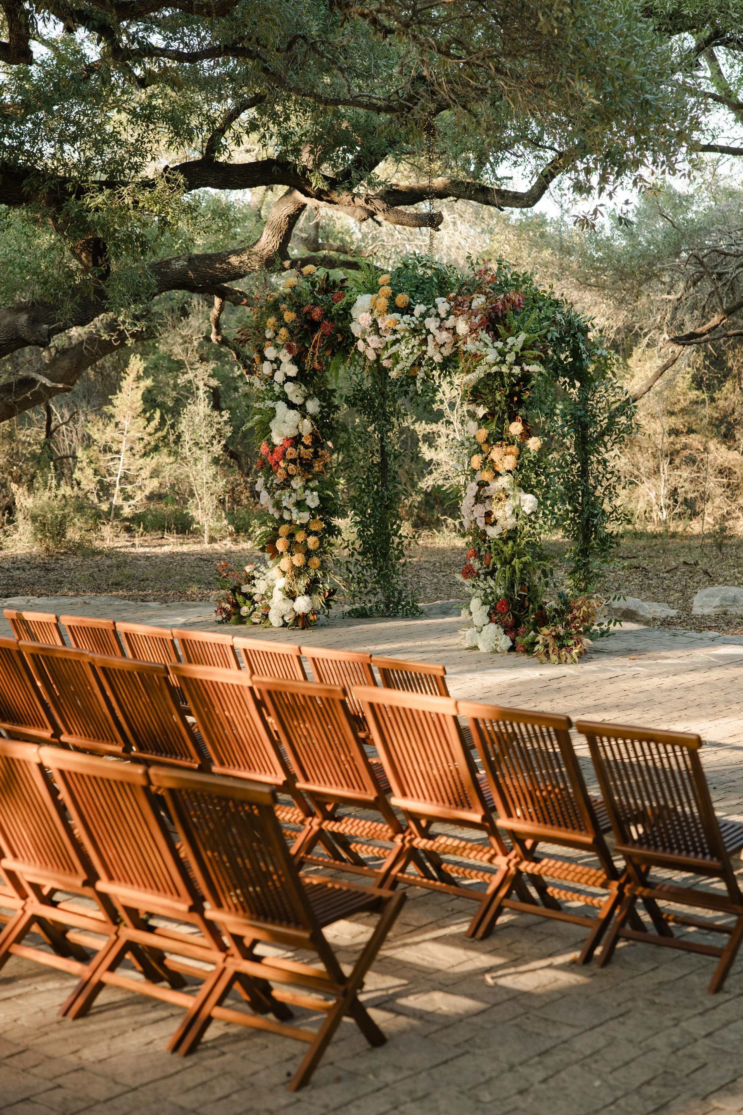 Wedding ceremony under oaks at Camp Lucy Sacred Oaks, Dripping Springs TX — Kristin Cattered Events, film photography by Lauren Nicole