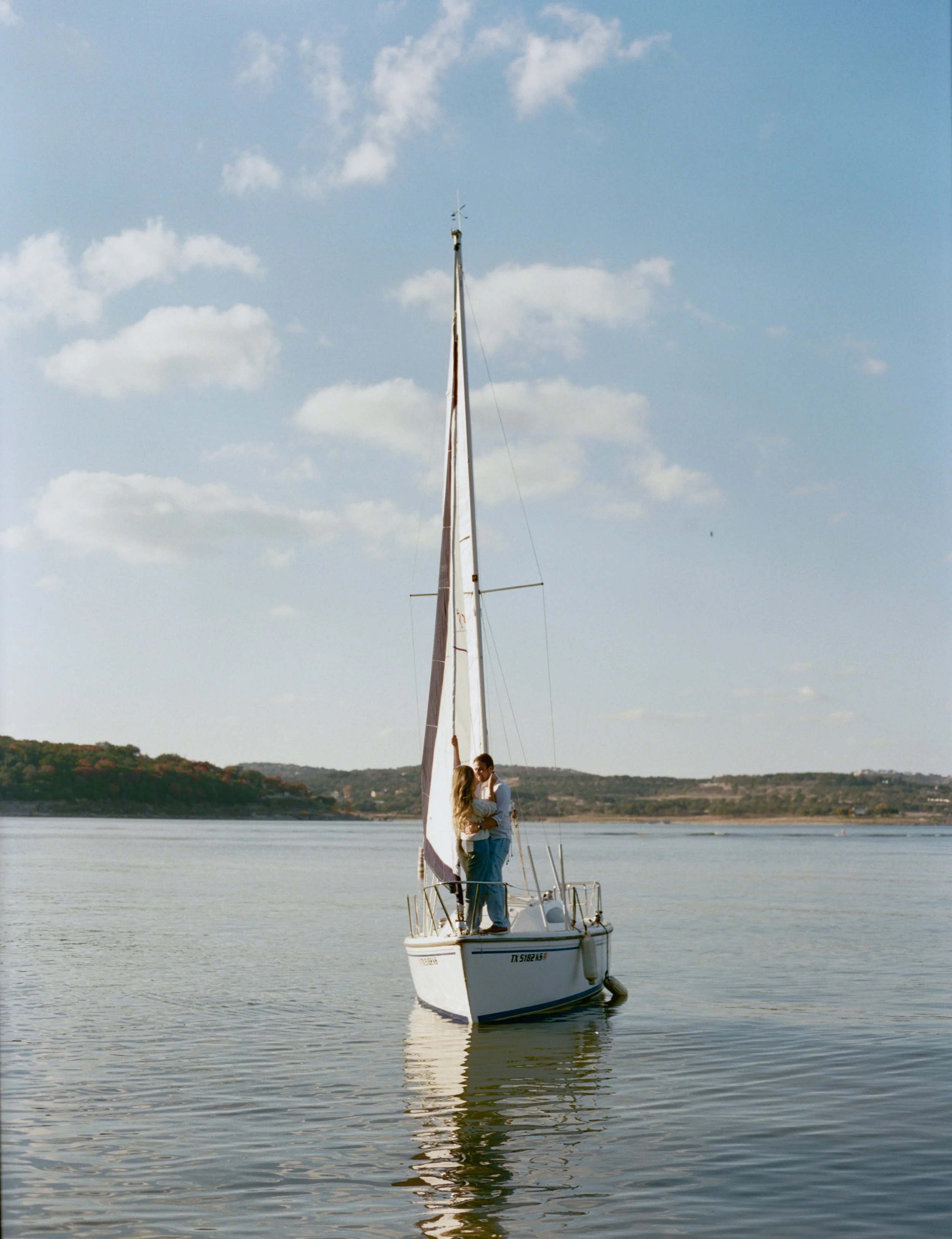 Sailboat engagement session on Lake Travis, Austin Texas — nautical coastal film photography by Lauren Nicole Photo