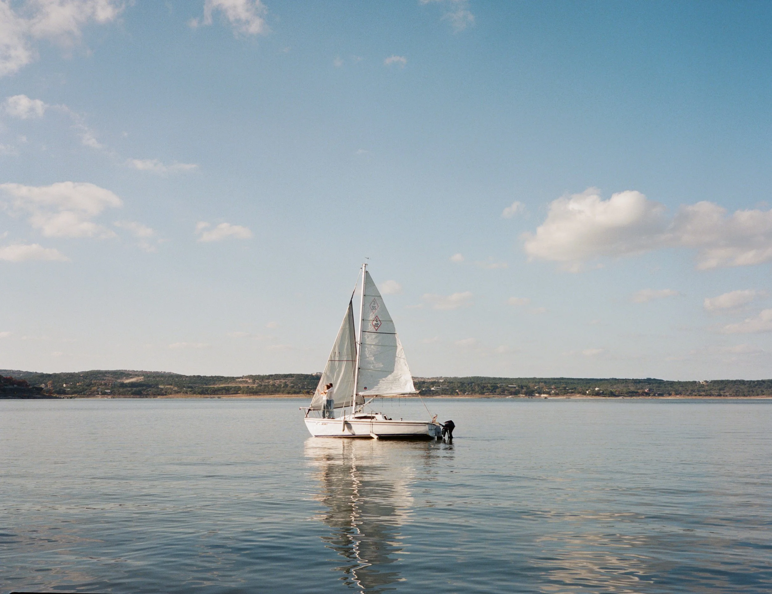 Sailboat engagement session on Lake Travis, Austin Texas — nautical coastal film photography by Lauren Nicole Photo