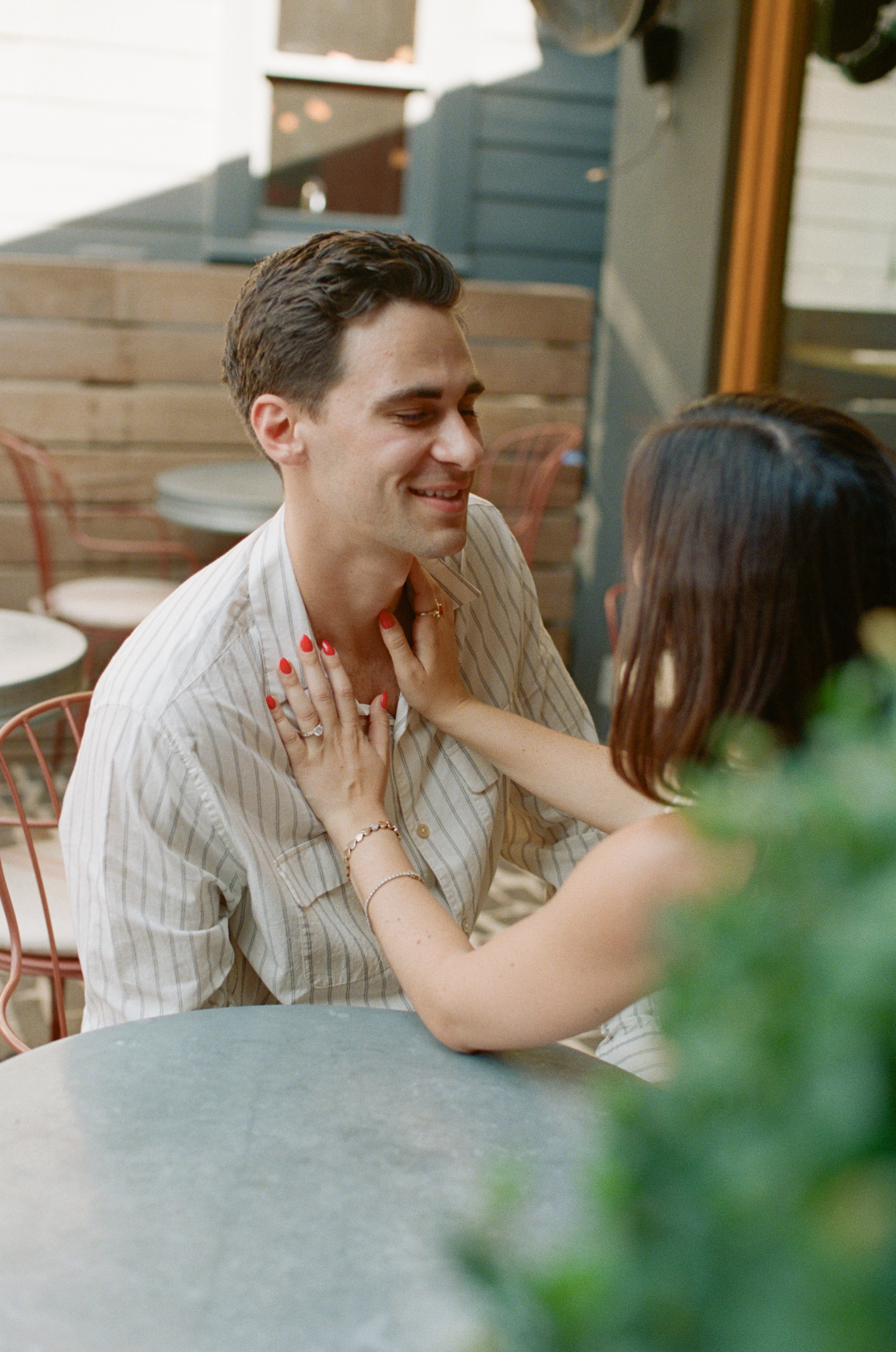Candid engagement portraits inside Rosie's Wine Bar, Austin TX — analog film photography by Lauren Nicole Photo