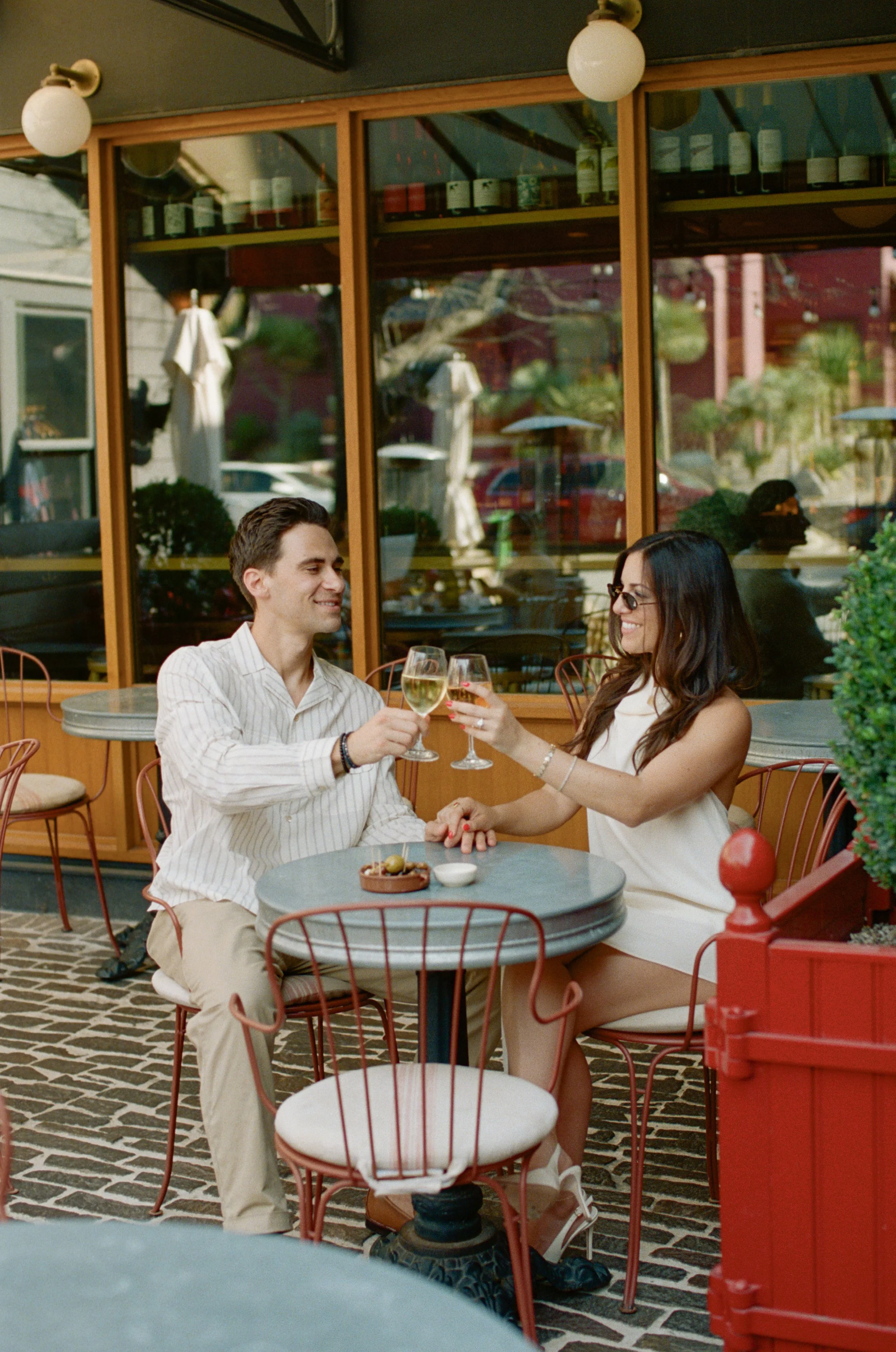 Candid engagement portraits inside Rosie's Wine Bar, Austin TX — analog film photography by Lauren Nicole Photo
