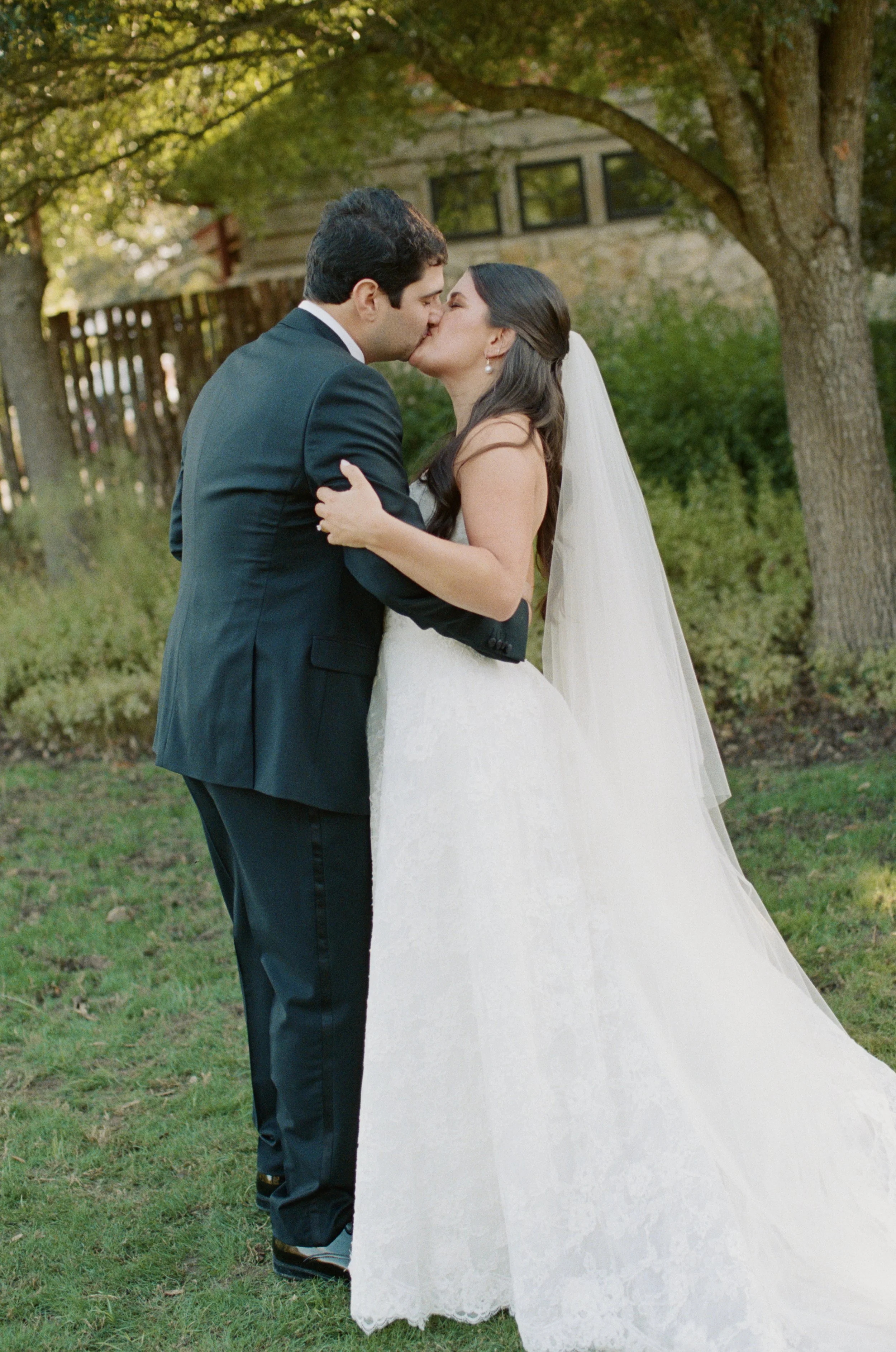 Wedding ceremony under oaks at Camp Lucy Sacred Oaks, Dripping Springs TX — Kristin Cattered Events, film photography by Lauren Nicole