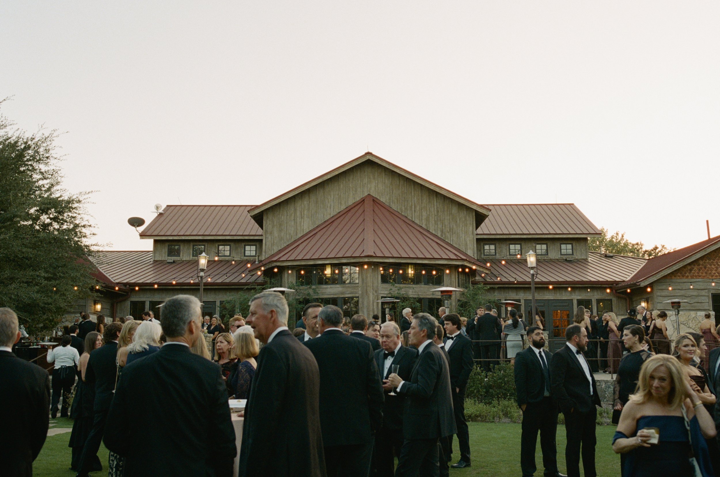 Old money floral wedding reception at Camp Lucy Sacred Oaks — candid documentary dance floor photography by Lauren Nicole Photo