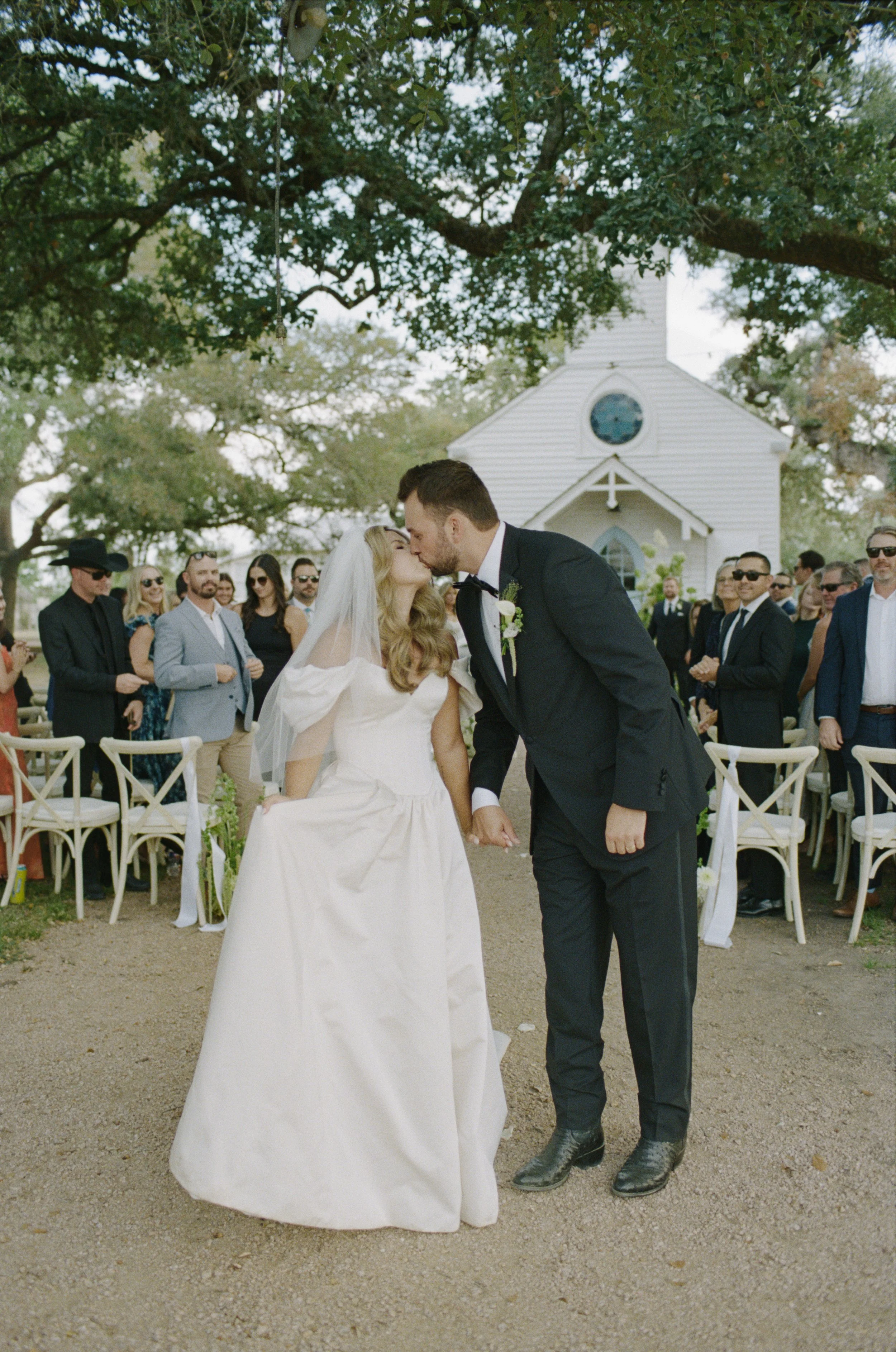 Wedding ceremony at Hotel Lulu Round Top Texas — southern chic western glam, candid film photography by Lauren Nicole Photo