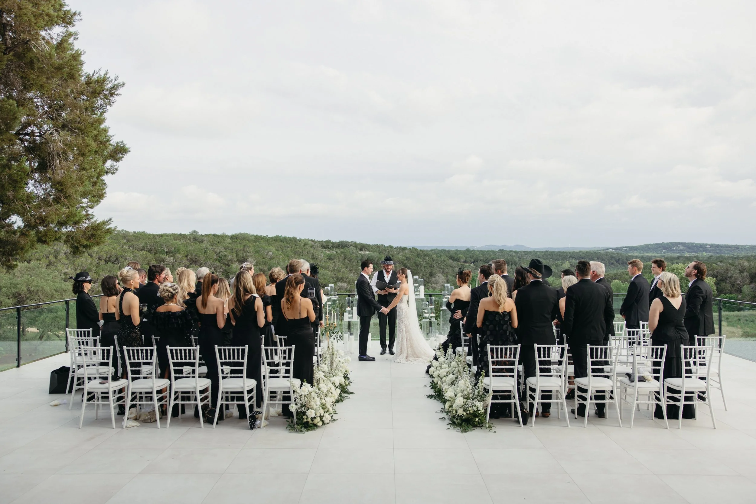 Wedding ceremony at The Videre Estate Wimberley Texas — Kentucky Derby aesthetic, black and white attire, film photography by Lauren Nicole Photo