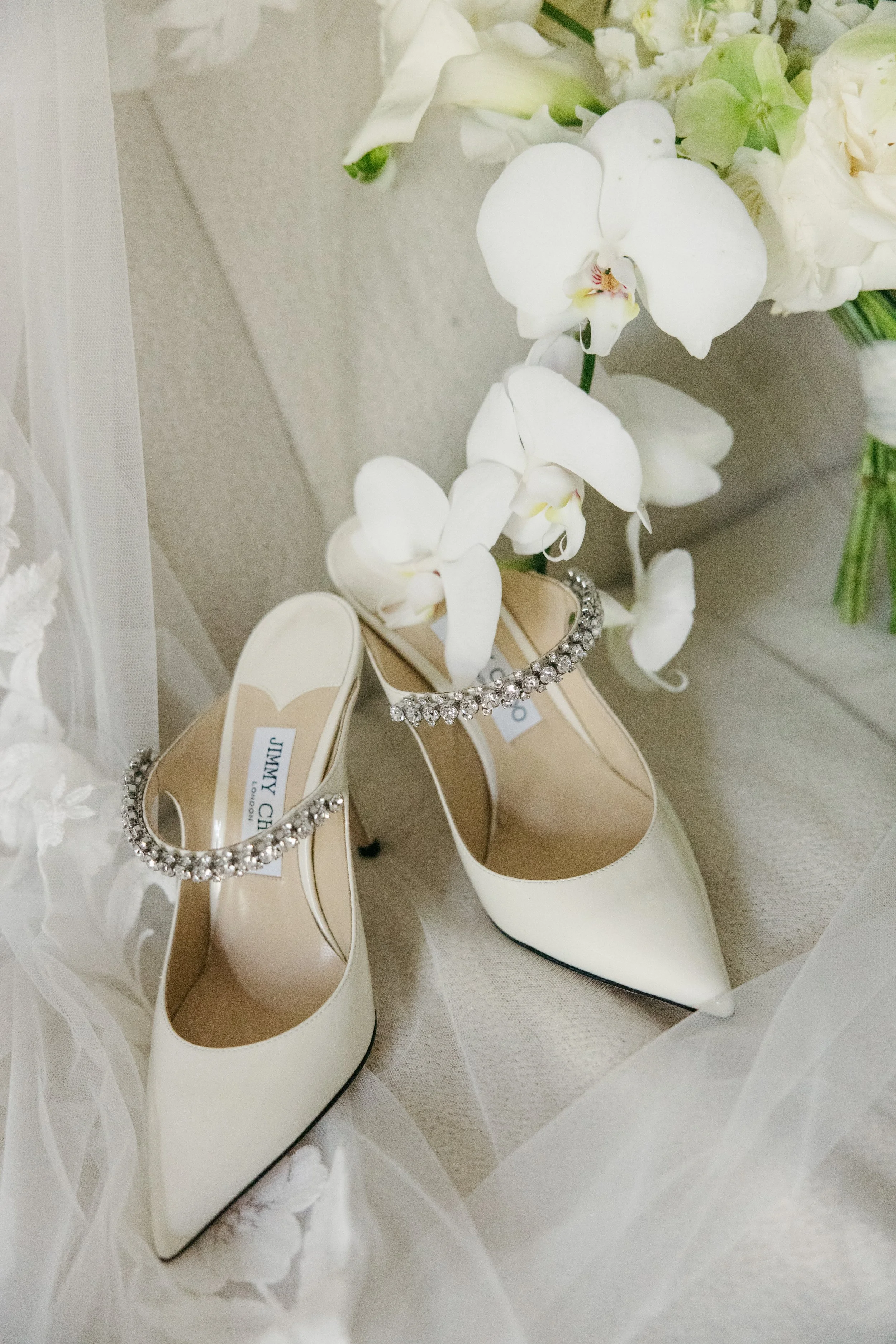Bride getting ready at Commodore Perry Estate Austin Texas — Jimmy Choo shoes, luxury editorial elopement photography by Lauren Nicole Photo