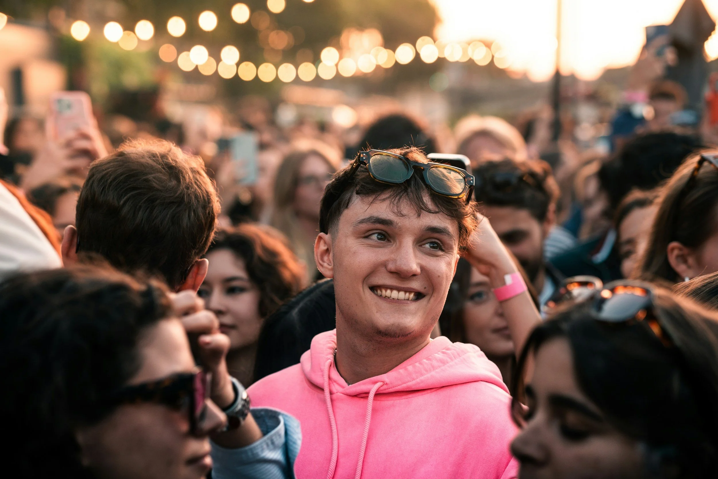 Person in crowd smiling.